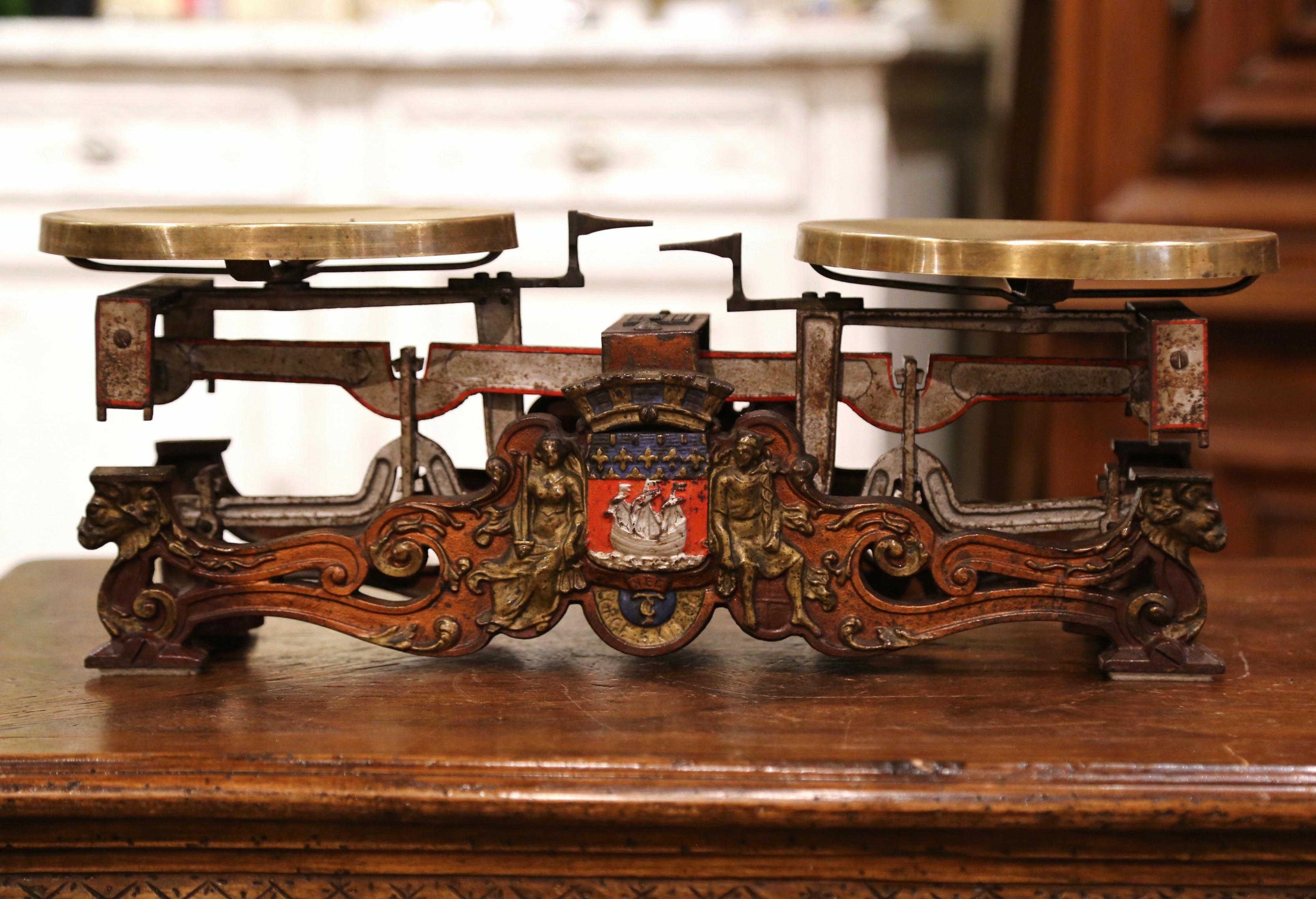 Decorate your kitchen counter with this elegant, colorful antique scale. Crafted in Versailles, France circa 1880, the scientific instrument is uniquely decorated with a Paris coat of arms in the center, with a sailboat and numerous Fleur-de-Lys