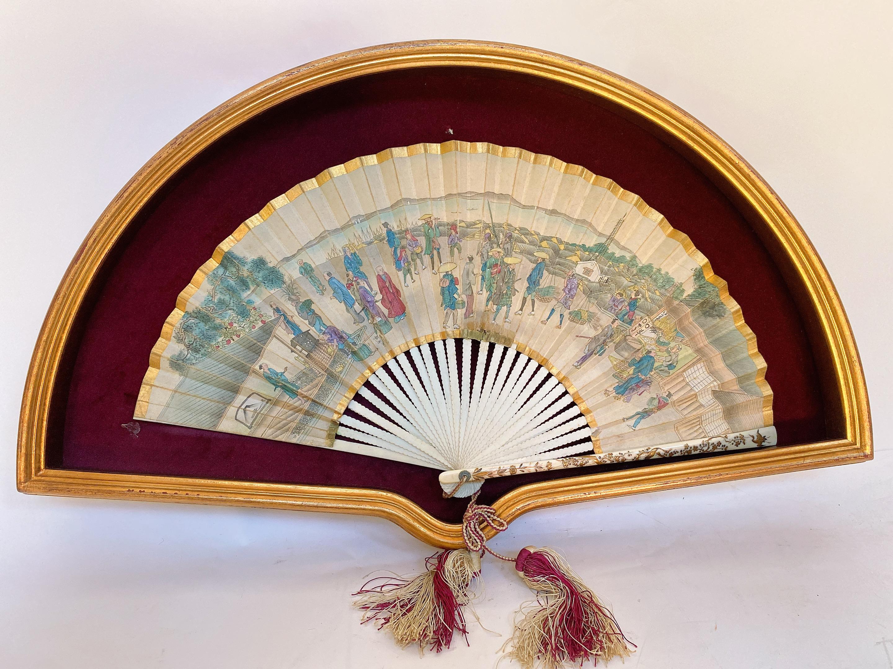 This ornate, antique paper hand fan was crafted in France, circa 1850. the one side showing a candlelit interior where Gallant scene on the reverse with a box but no glass of box. See more pictures.