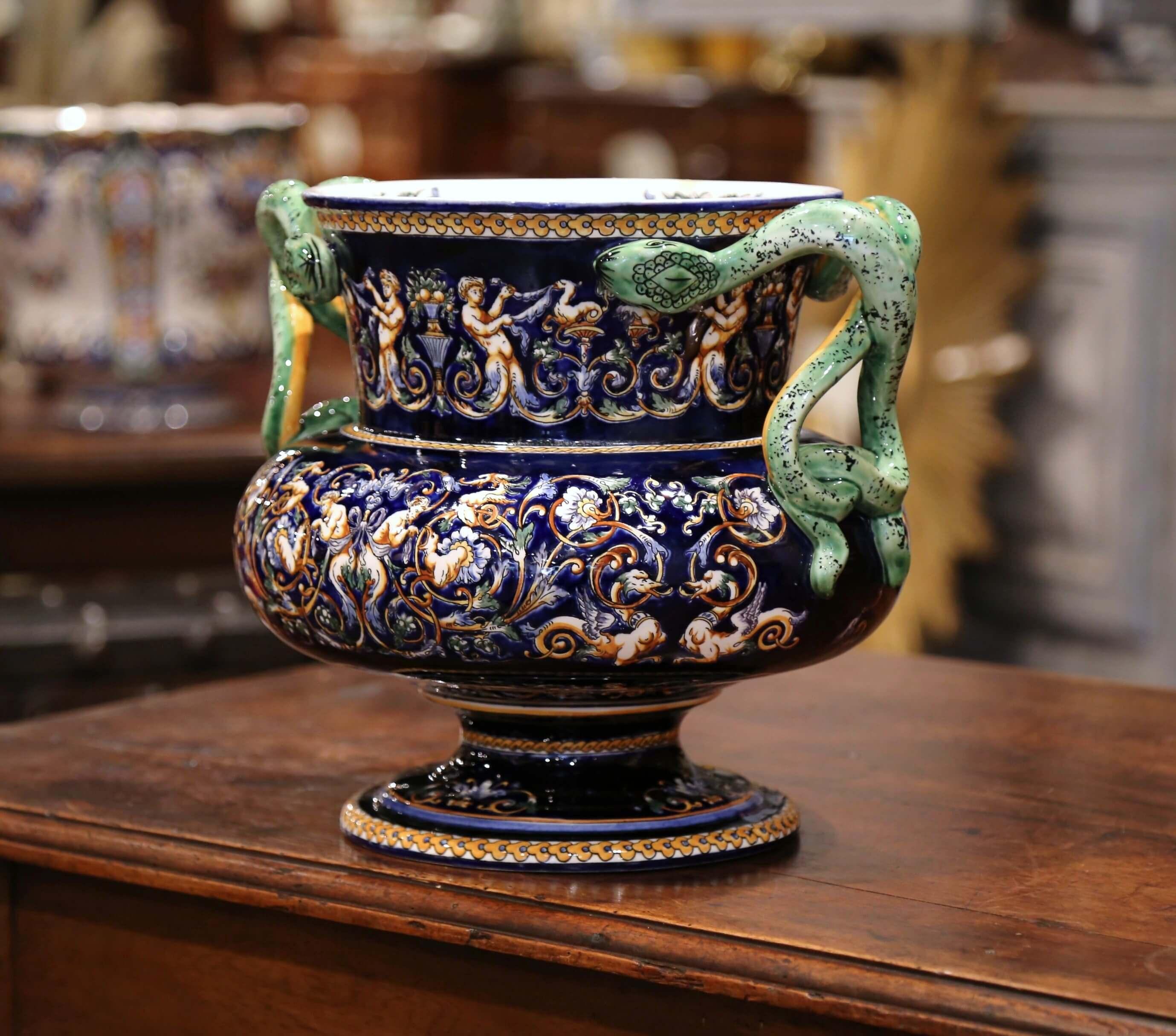 This round and colorful antique planter was created in “Faïencerie de Gien,