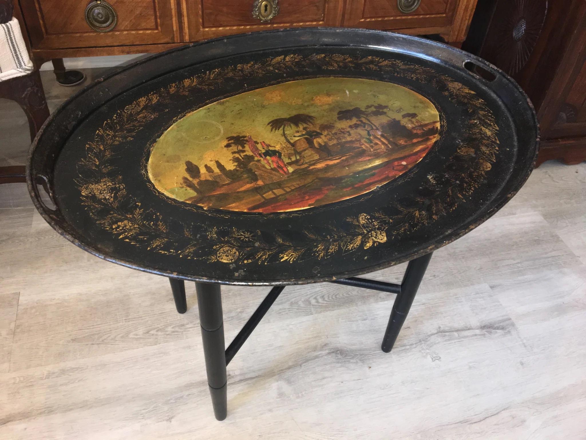 19th century French tole tray with beautifully executed, detailed and original painting, likely relating to French Polynesian Islands. Tray is earlier than the stand, but the stand appears to be later 19th century. The tray alone looks lovely