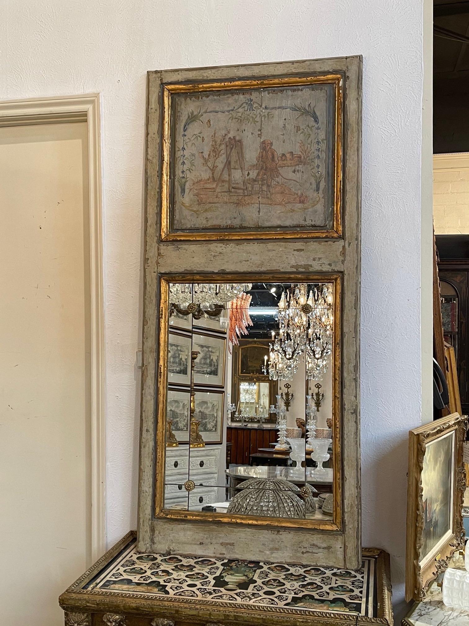 Lovely 19th century French painted Trumeau mirror featuring a painted scene with monkeys. Also note the divided mirror sections. An interesting accessory!