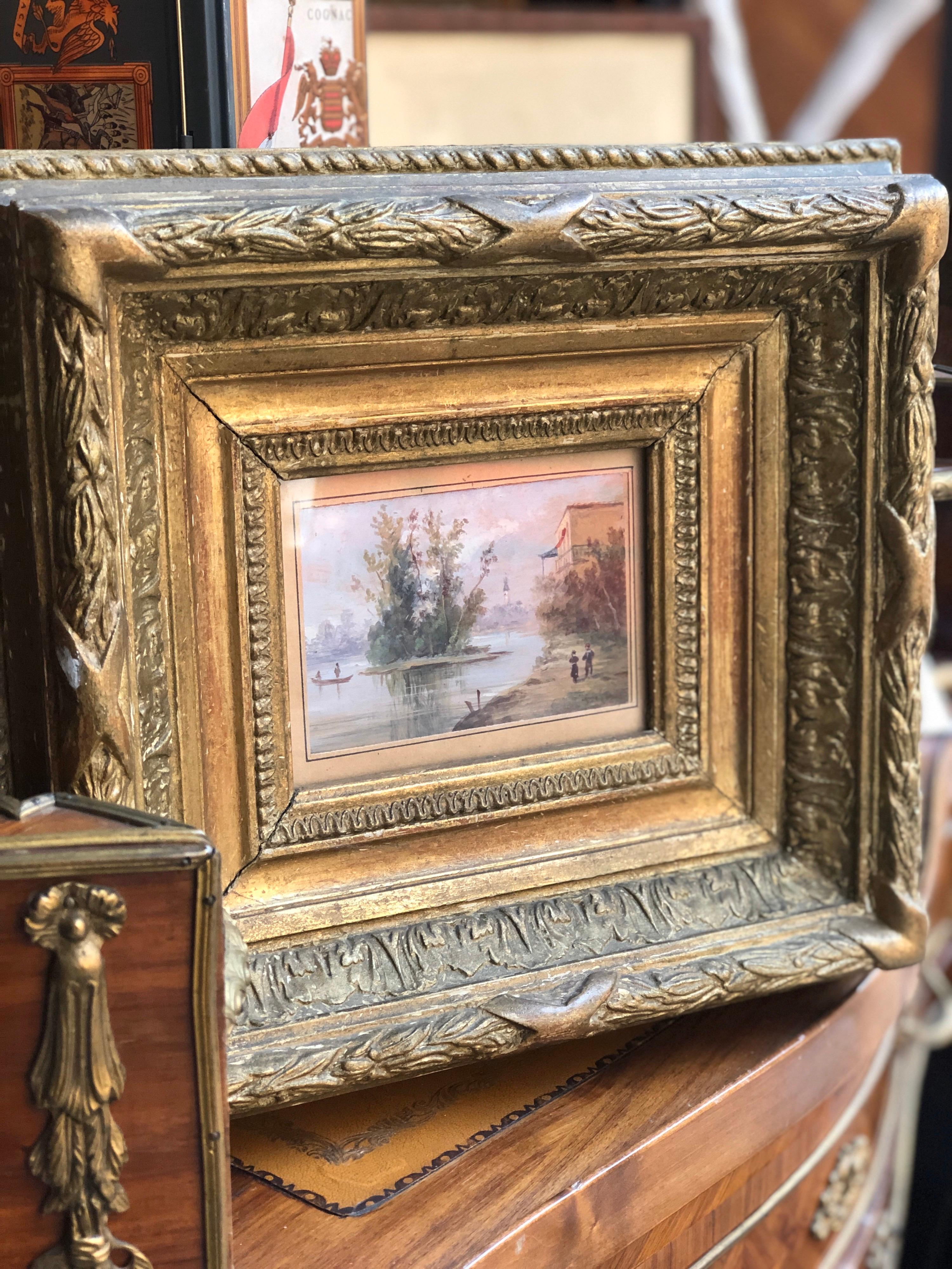 Small painting dated 19th century representing beautiful riverside landscape in light colors with few accents and figures that grab your attention right away! Amazing giltwood frame that matches the painting perfectly!
France, circa 1880.