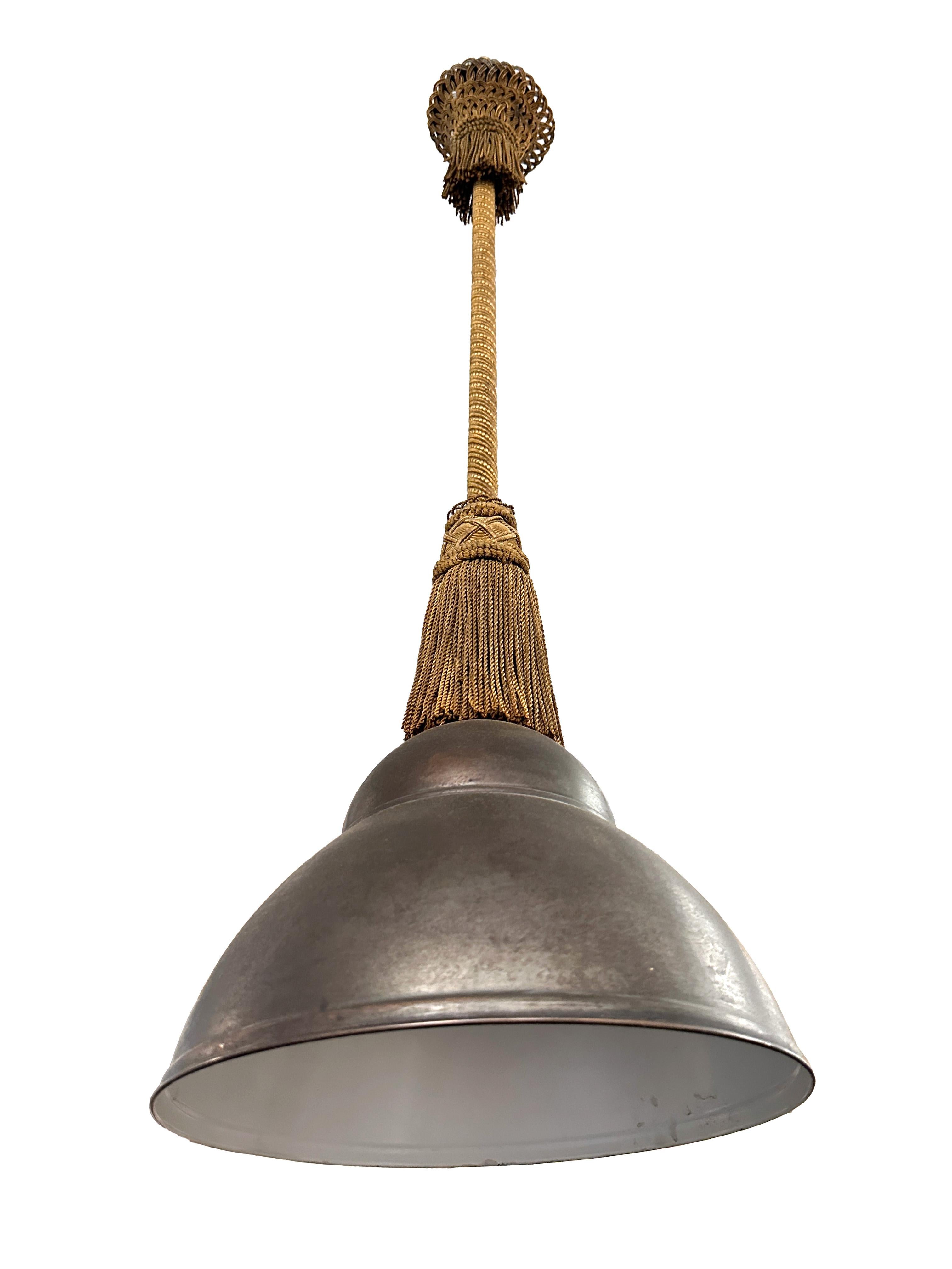 A bell shaped 19th century pair of french pendant lights. Made out of copper with a beautiful woven gold tassel detail with fringes. Very unique pendenat design. 

Property from esteemed interior designer Juan Montoya. Juan Montoya is one of the