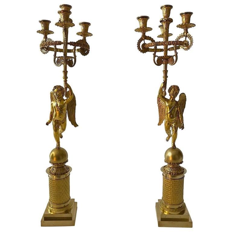 Gilt 19th Century French Pair of Empire Candelabra Gilded Flambeaux with Putti For Sale