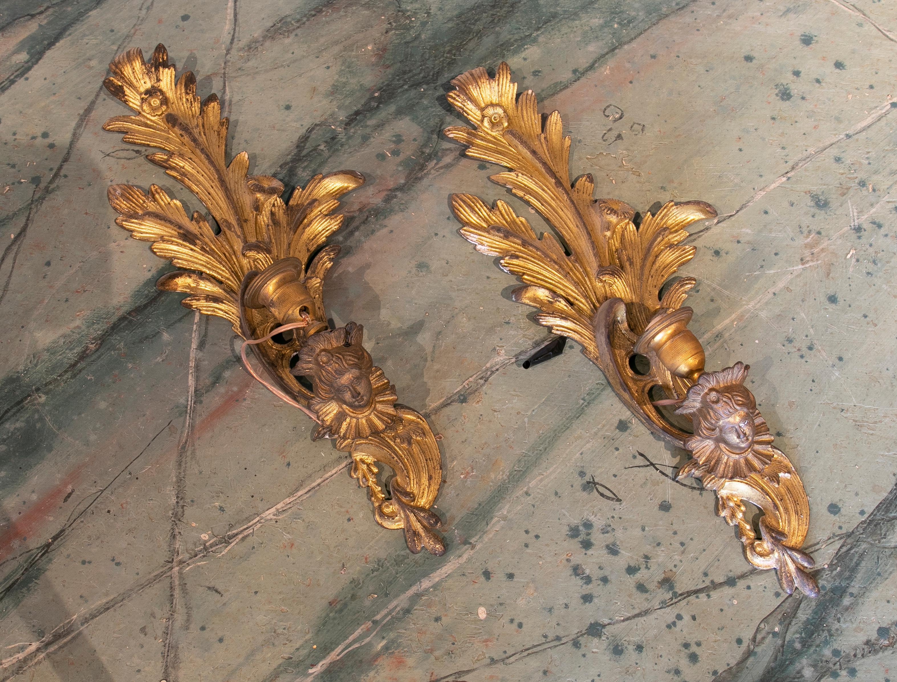 19th Century French Pair of Gilded Bronze Sconces with women decoration.
