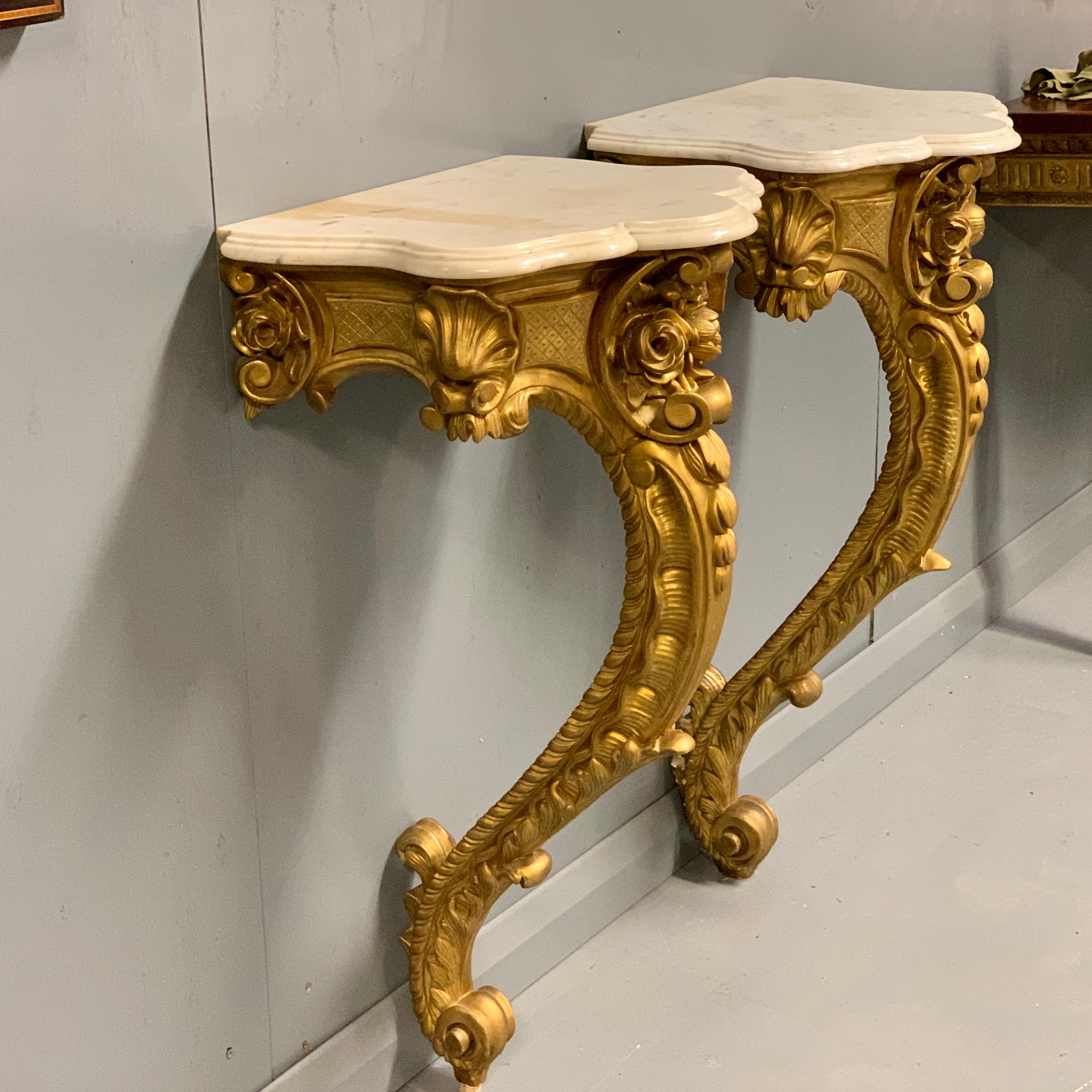 Beautiful pair of mid-19th century French gilt wall mounted console or pier tables with original Carrara marble tops.
Super quality and very elegant pair of console tables, often at this size they would be used between windows, thus known as 