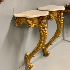 19th Century French Pair of Gilt Wall Mounted Console Tables with Marble Tops