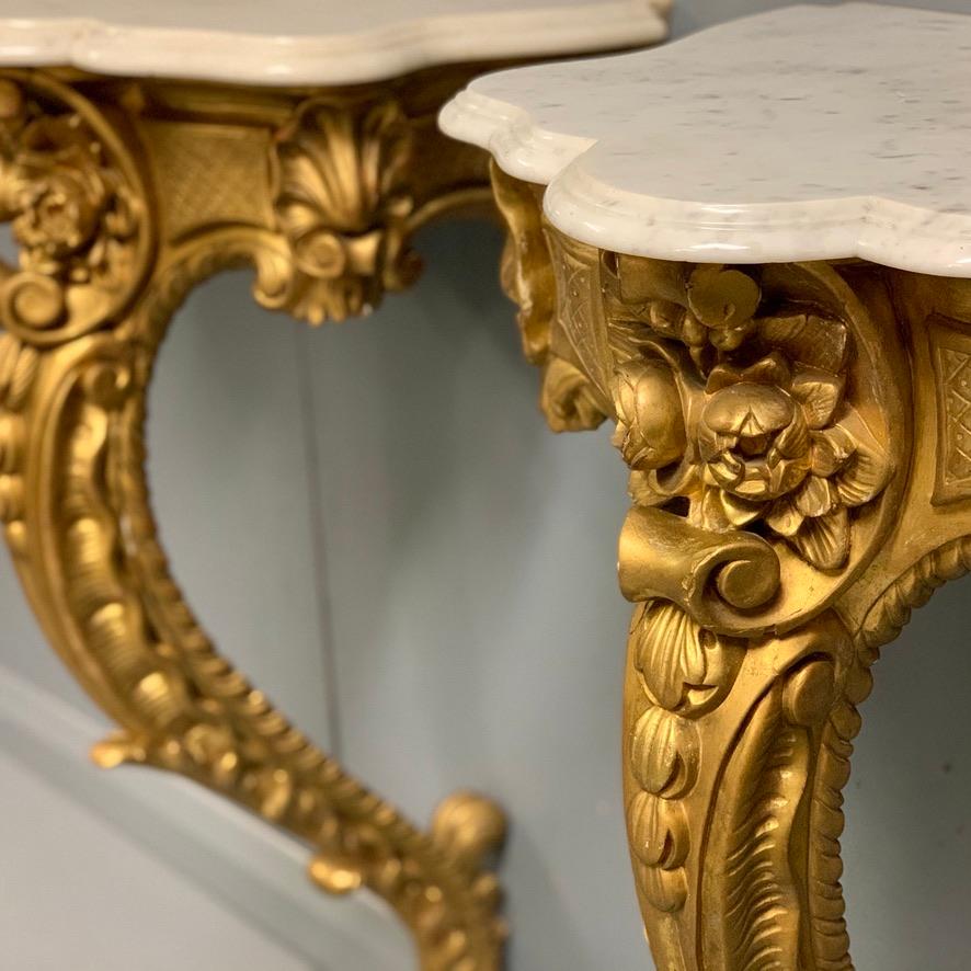 Louis XV 19th Century French Pair of Gilt Wall Mounted Console Tables with Marble Tops For Sale