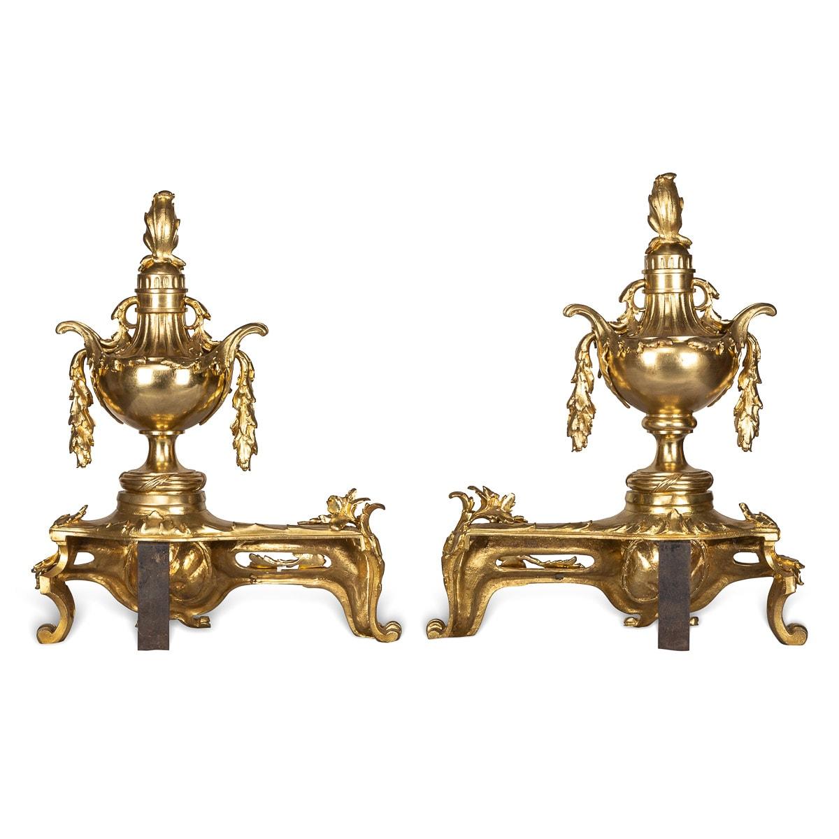 Antique 19th century French beautifully cast pair of gilt bronze fireplace chenets. These chenets are adorned with beautiful floral decoration, scrolls, garlands and swags, with two lidded uns and on scroll feet.

CONDITION
In Great Condition -