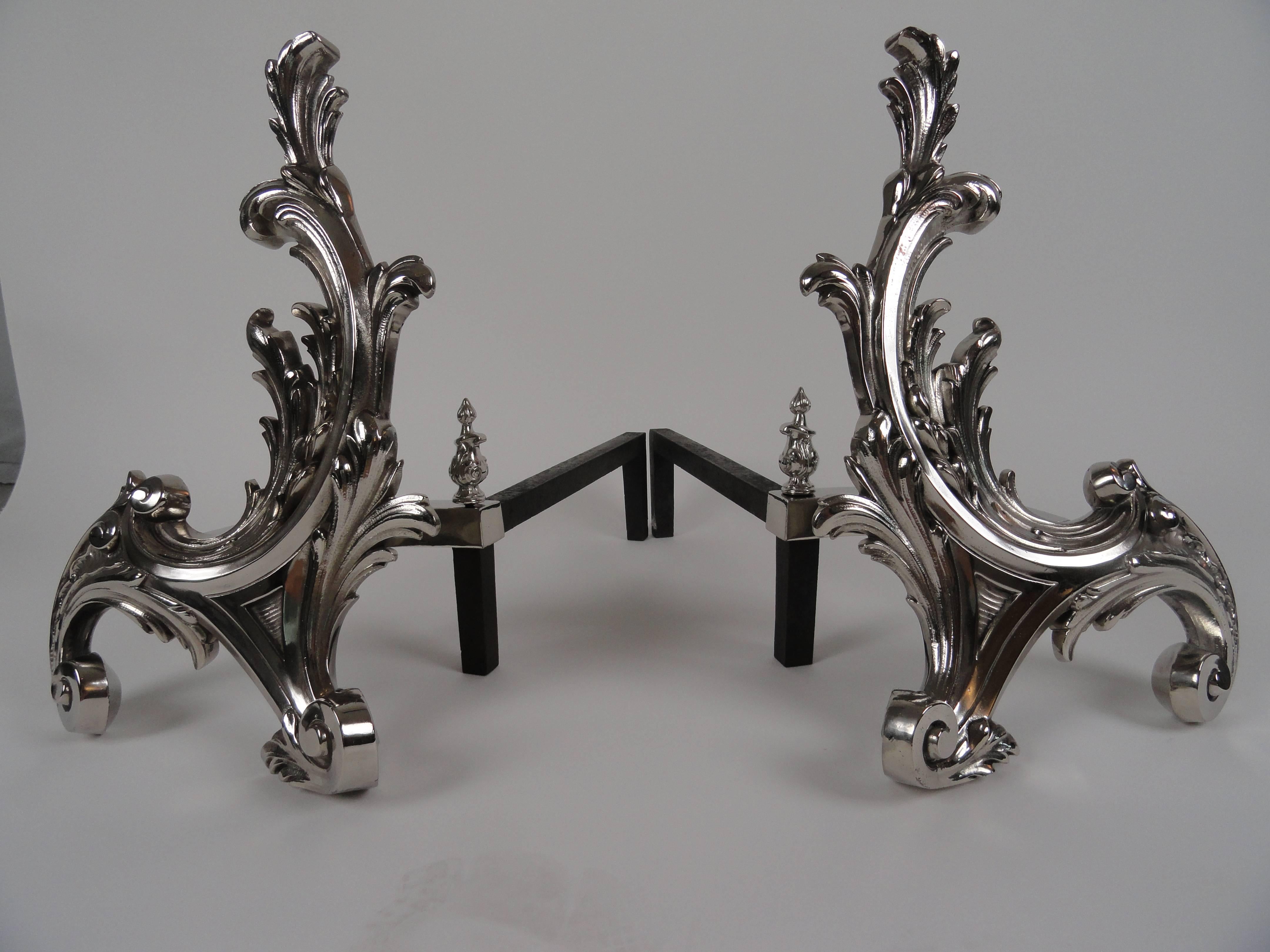 Pair of French, 19th century Rococo-style chenets. Brass andirons with polished nickel finish. Imported from France by William Jackson of New York.