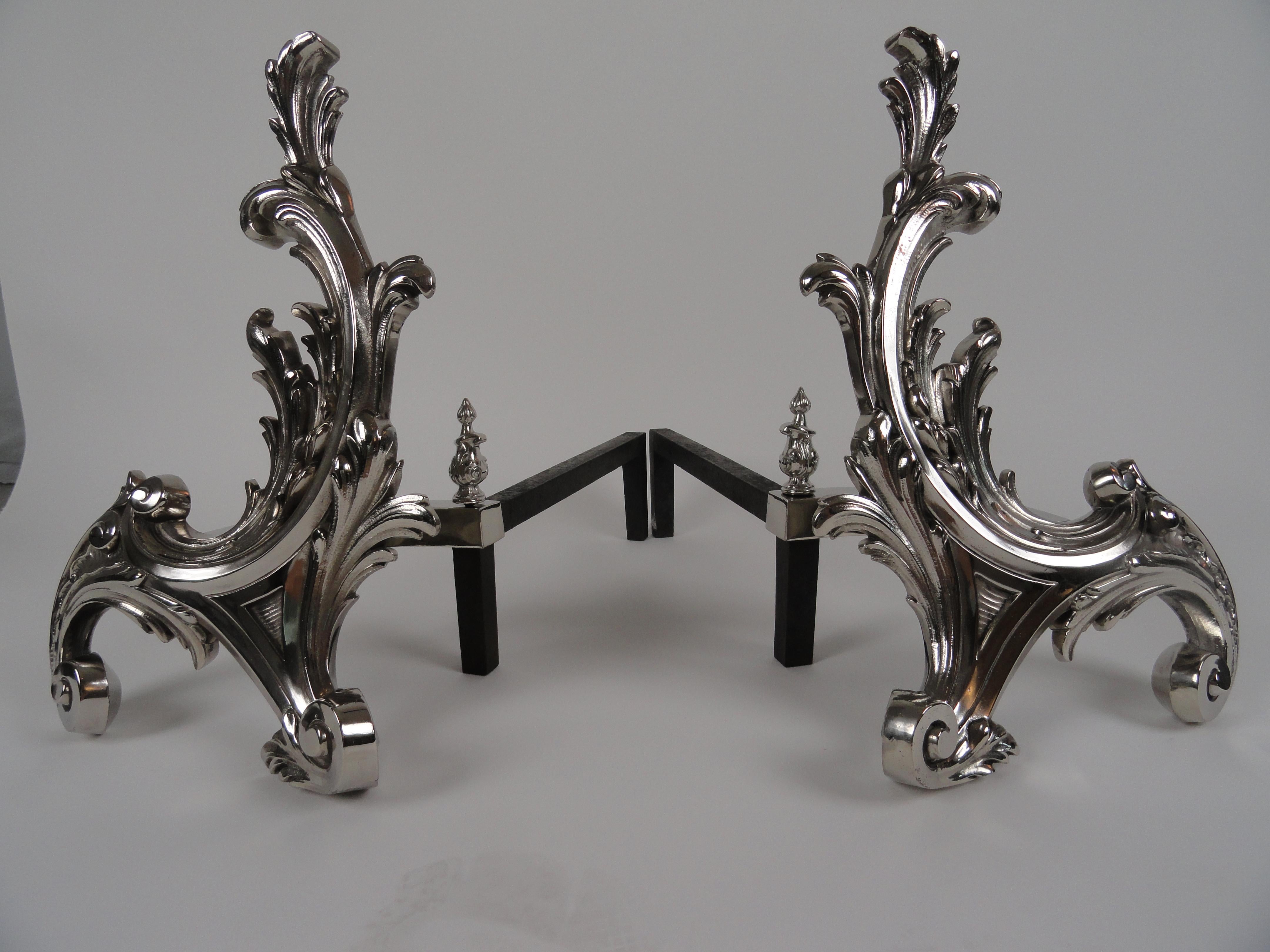 Pair of French 19th century Rococo style chenets. Brass andirons with polished nickel finish. Imported from France by William Jackson of New York.