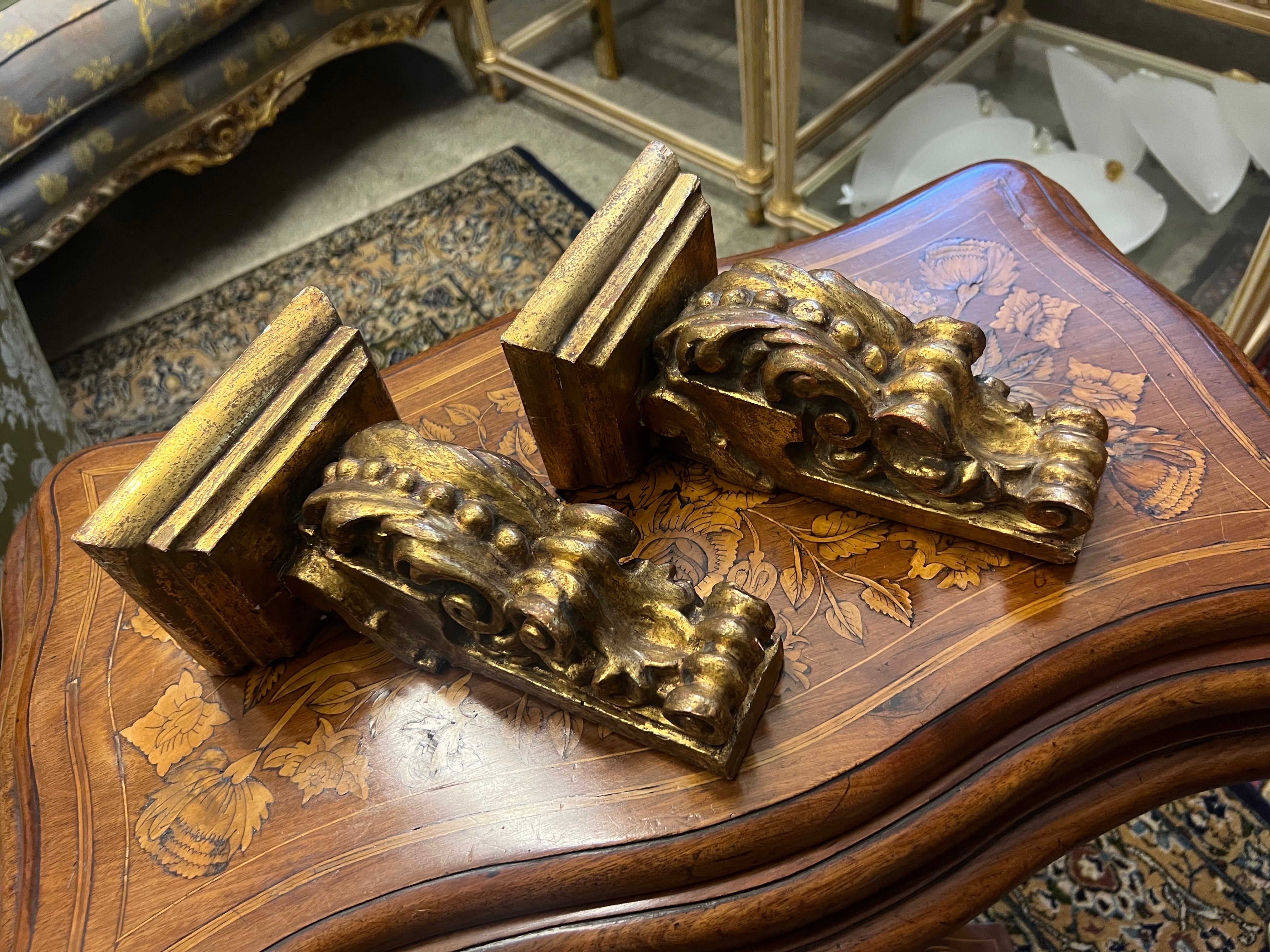 19th Century French pair of small gilt wood hand carved wall mounted consoles in Rococo style. Both made with symmetrical decoration and ornaments all in very good authentic condition with no restorations made.
France, circa 1890