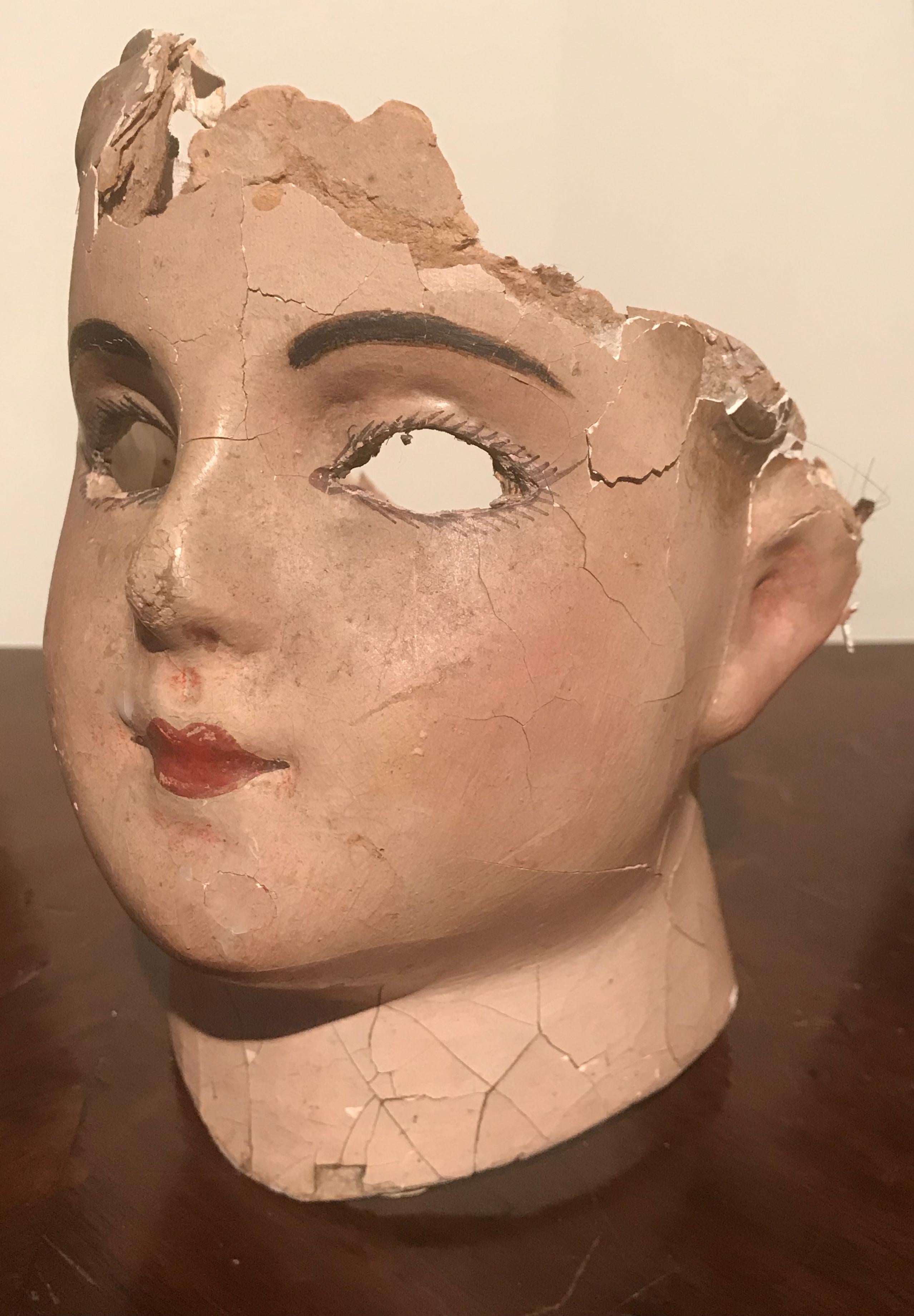 French papier mâché doll head retaining the original paint. A lovely sculpture to create an original vignette.
