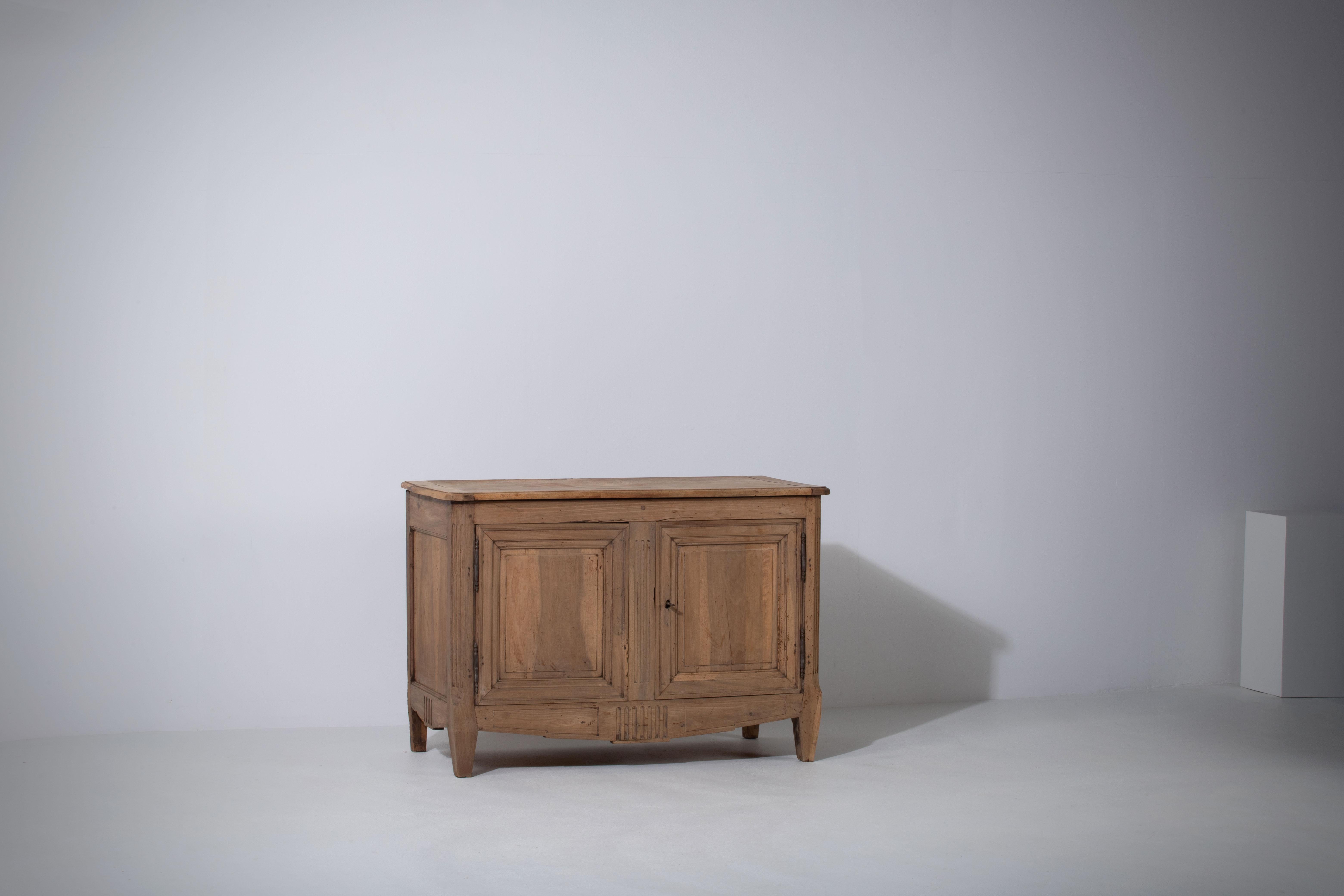This magnificent Provencal cabinet from France is a true marvel of craftsmanship, rich with history and authentic charm. Dating back to circa 1890, this piece exudes the casual yet refined aesthetic of the French countryside and represents the