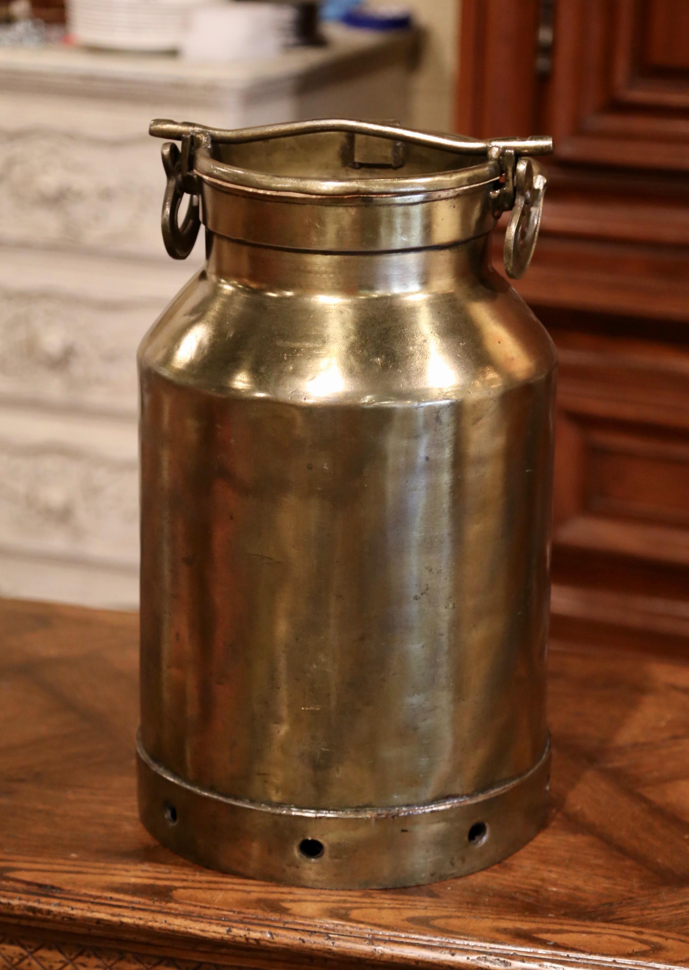 Keep your house organized by placing this beautiful, antique milk can as an umbrella stand by your front or back door. Crafted in France circa 1880, the tall brass container has a moveable, arched top handle and original removable lid. The large,