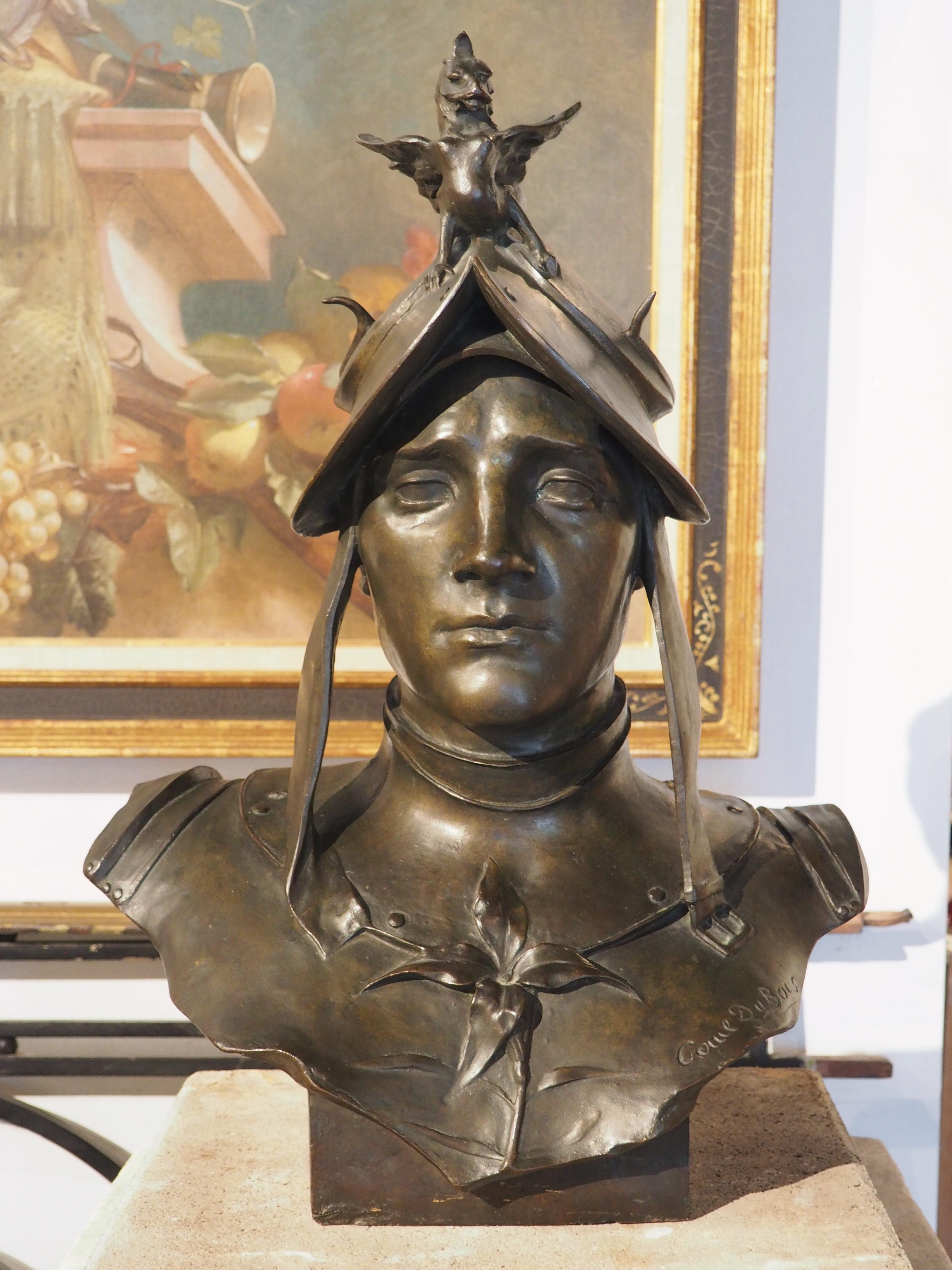 Cast in France during the 1800s, this patinated bronze bust depicts a woman soldier, based on the style of hair and the ceremonial accoutrement on the armor cuirass. Our stoic soldier has a four-petal flower adorning the breastplate (to the viewer’s