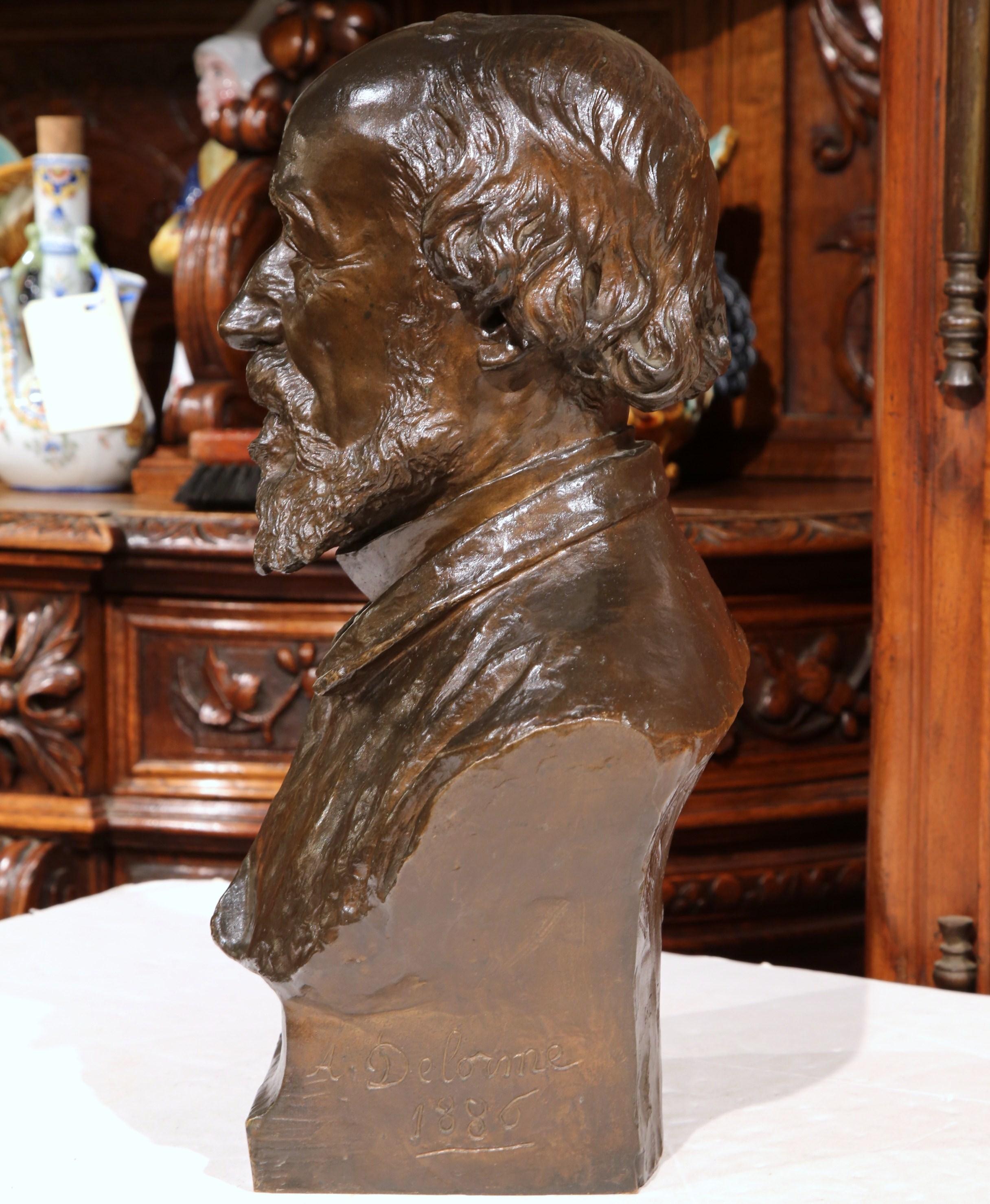 This elegant bronze bust was created in Paris, France. The masculine, figural sculpture depicts the face of a French politician; it is signed and dated on the side by French sculptor A. Delorme, 1886 with foundry's name engraved in the back: Gruet,