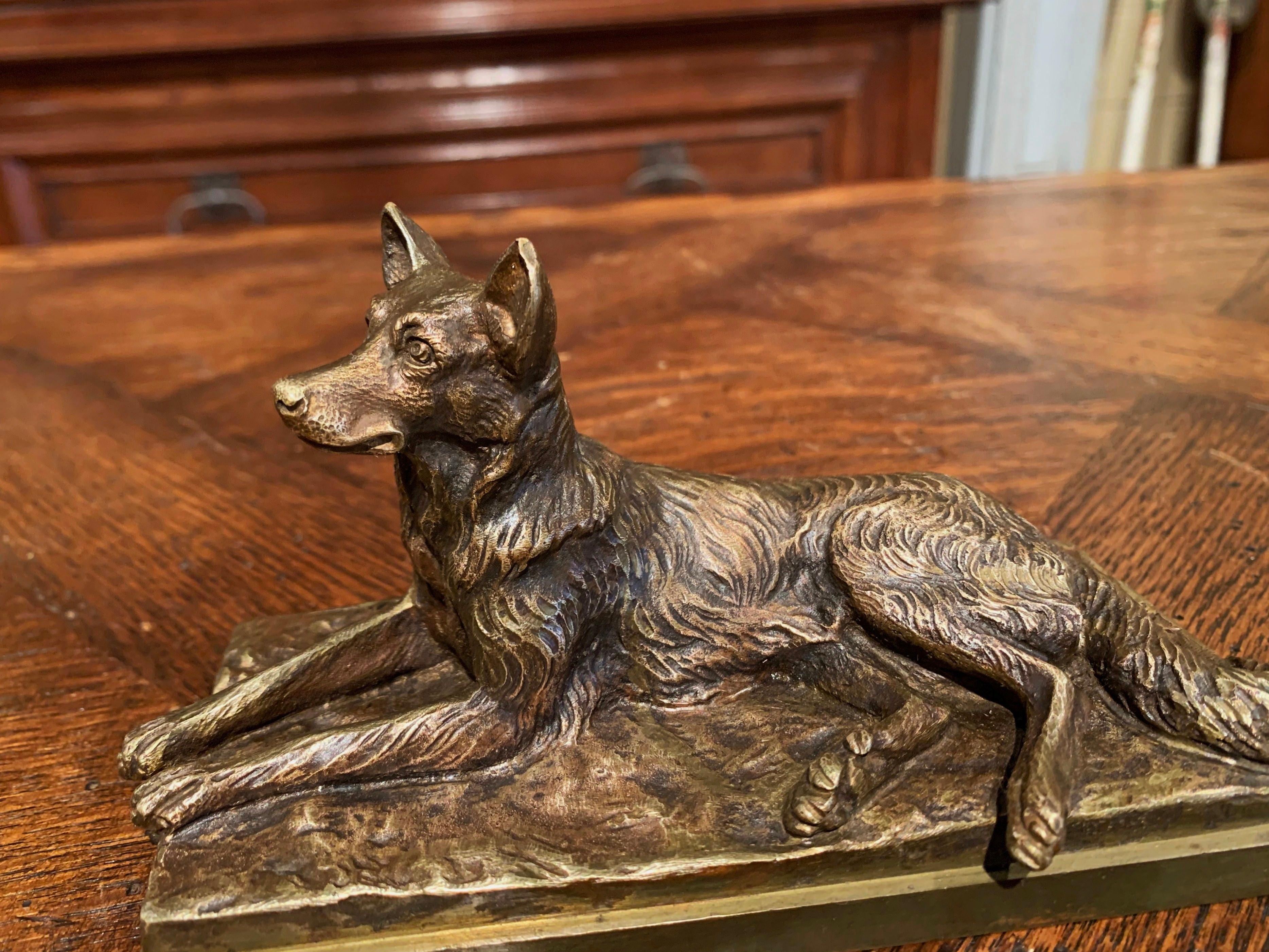 This antique bronze sculpture was created in France, circa 1890. The composition features a German shepherd lying on rocky ground. The dog figure is signed on the back by the artist, Albert Laplanche. The elegant piece is in excellent condition with