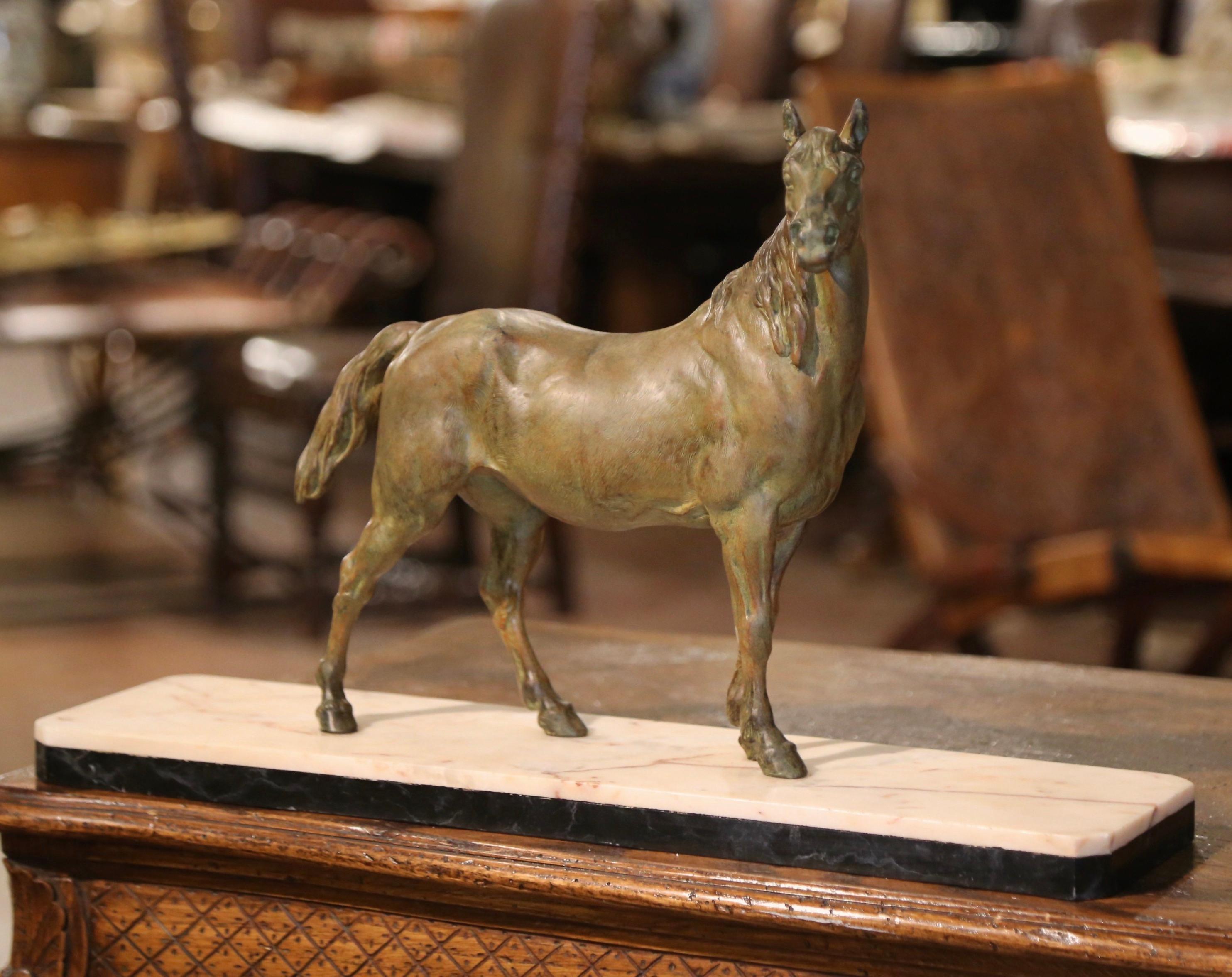 Decorate a man's desk or a library shelf with this antique horse sculpture. Created in France, circa 1890, the figure sits on a large rectangular variegated white marble base; the sculpture depicts a proud stallion in a standing position its head