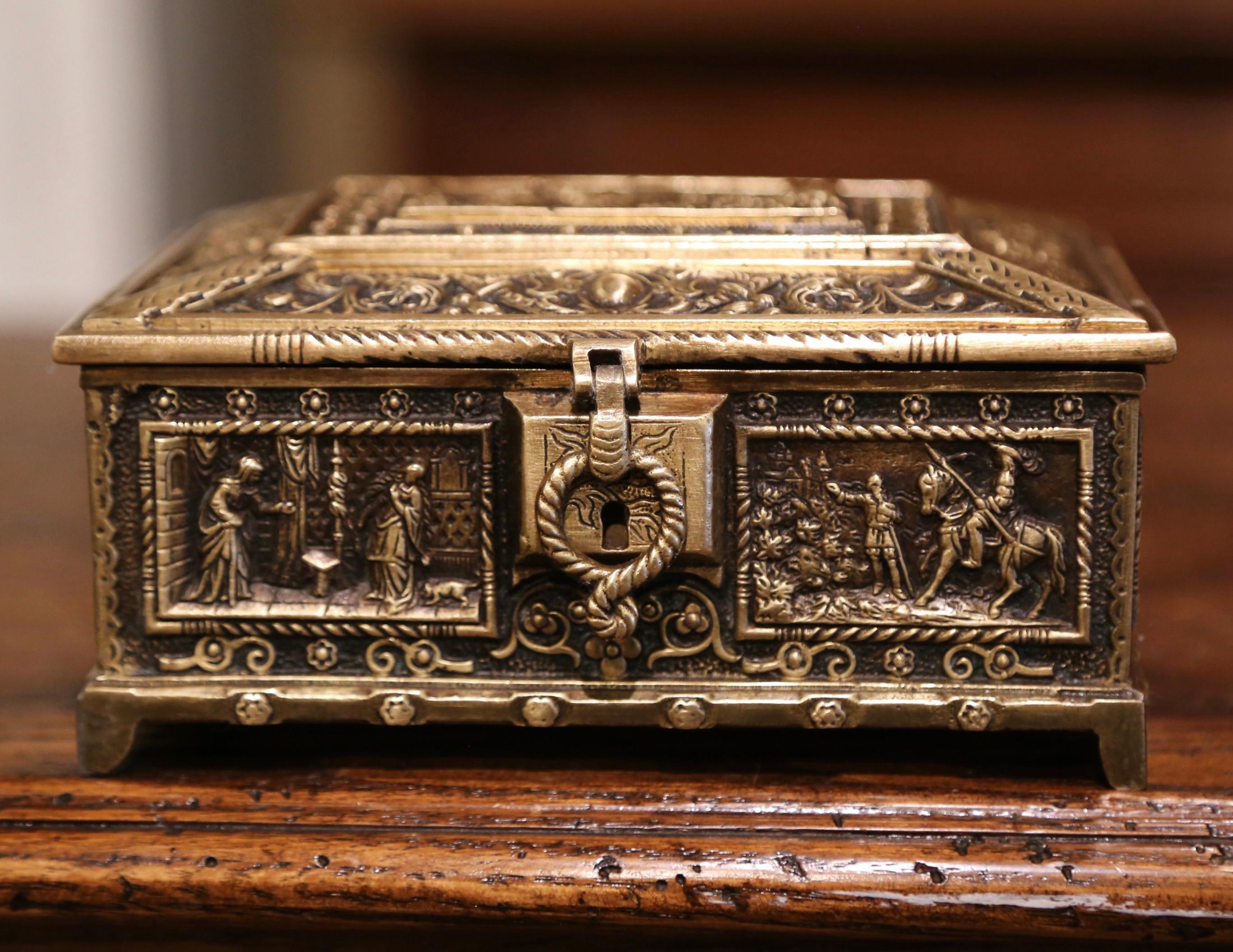 This antique Renaissance casket was created in France, circa 1880. Rectangular in shape, the gilt bronze box is embellished with mythological motifs, including a courting scene on the top. The detail work is outstanding with bas relief decor on all
