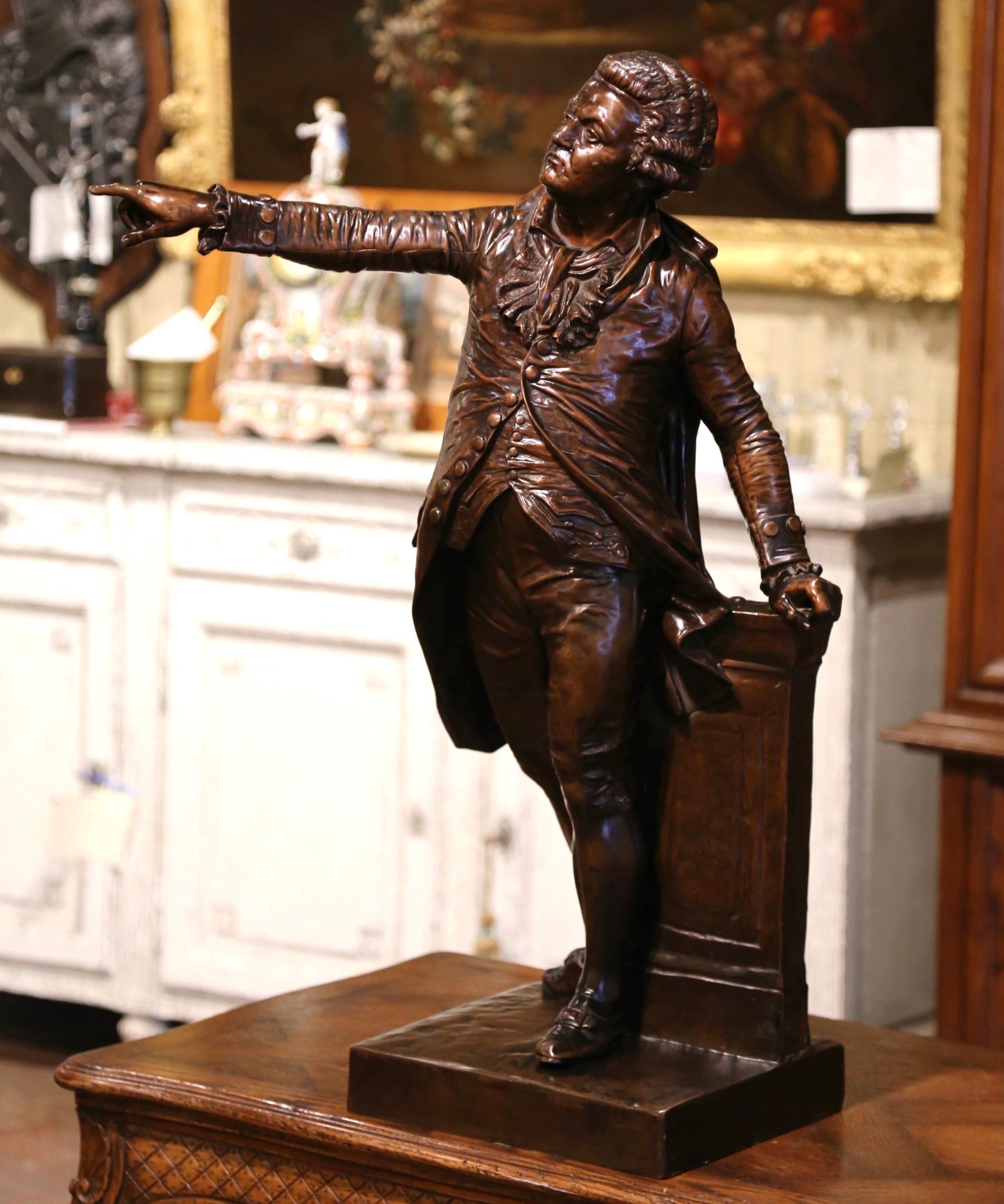 This large antique bronze sculpture was crafted in France; the bronze figure depicts the French politician Mirabeau and is signed, stamped and dated on the base by Francois Joseph A. Truphene, 1857. This very detailed work of art is in excellent
