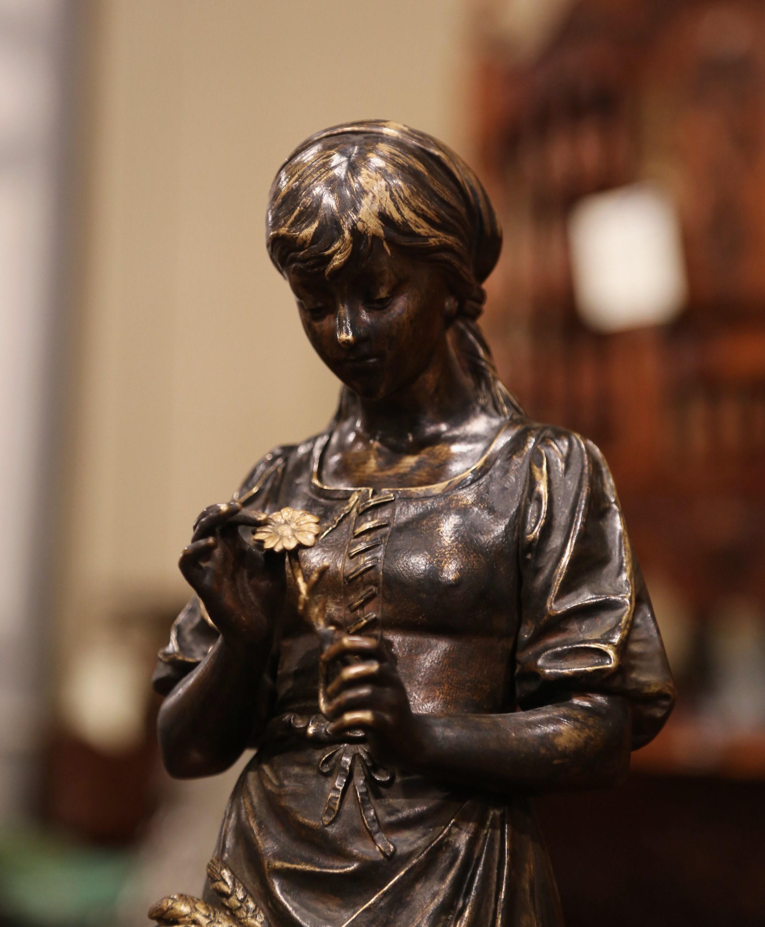 Decorate a shelf or a desk with this elegant antique bronze patinated sculpture. Crafted in France, circa 1870, the bronze features a young beauty coming back from the fields carrying sheaves of wheat. The woman figure is in excellent condition with