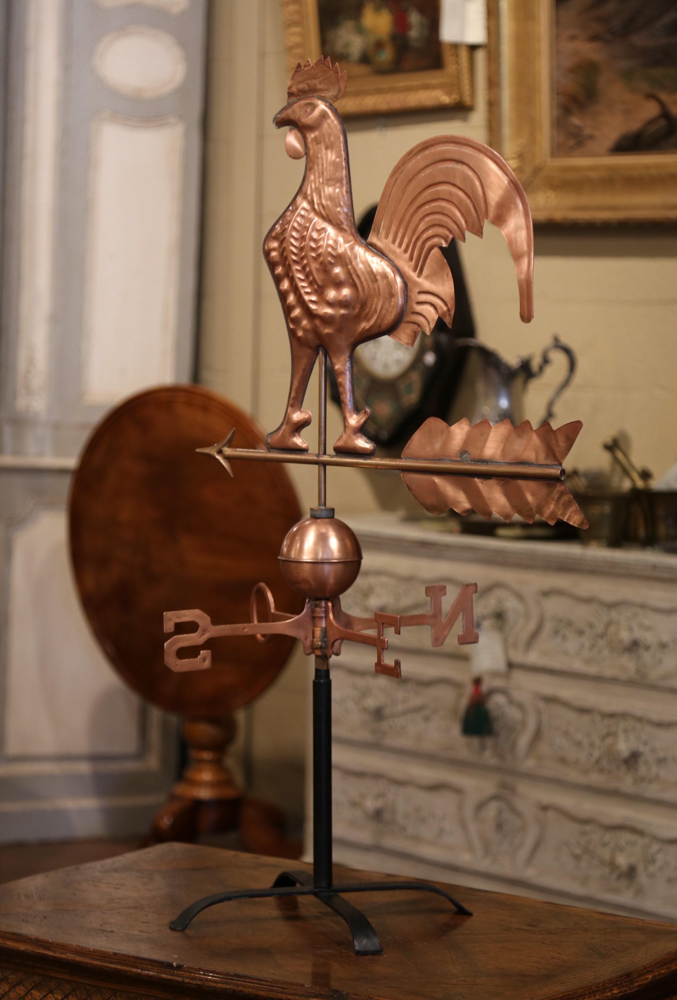 This elegant antique weather vane was created in Normandy, France, circa 1860. The traditional copper sculpture features a classic swivel French chanticleer rooster standing on an arrow; below, the four points of the compass swivel according to wind