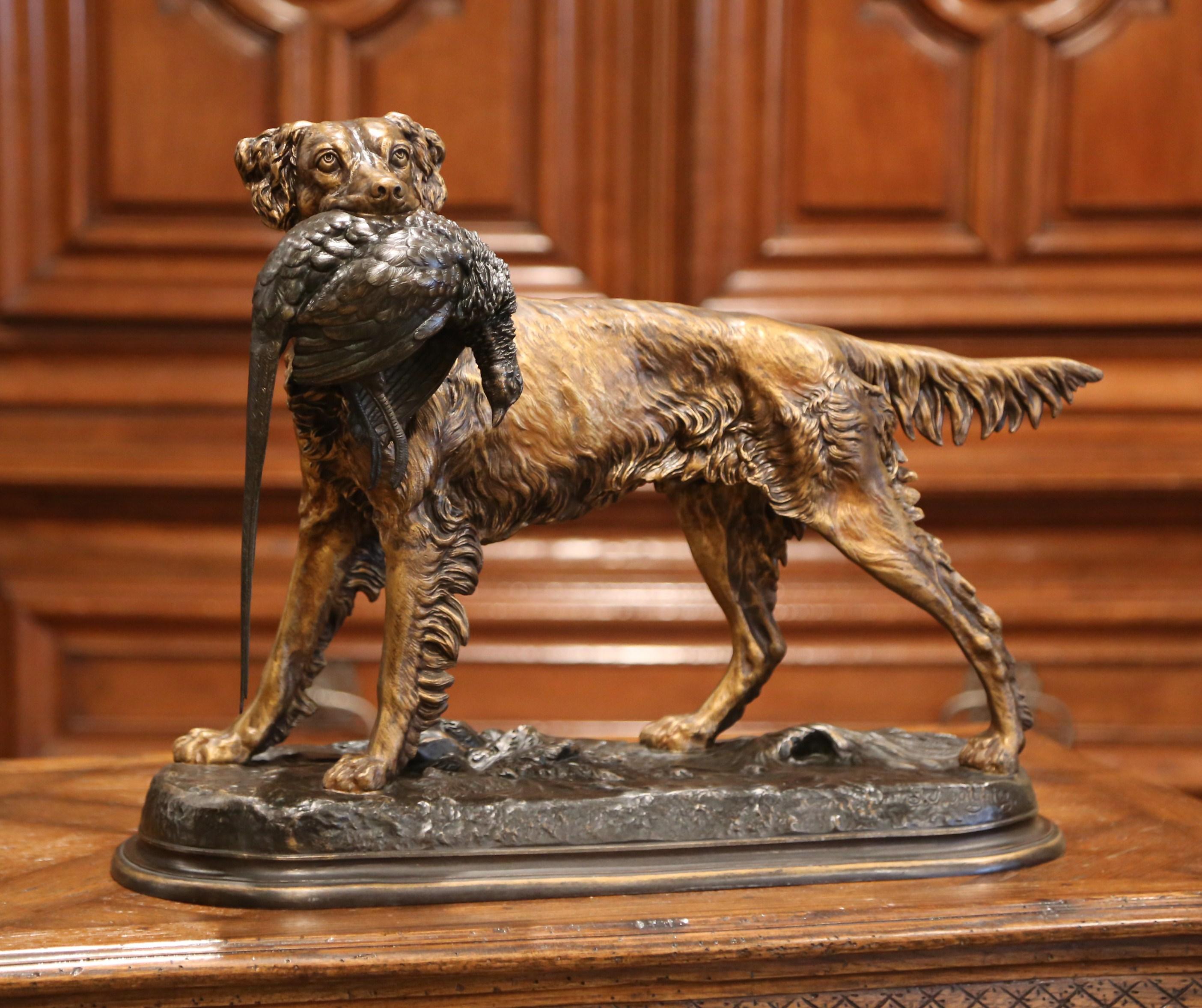 Decorate a man's office or library with this antique spelter dog and bird sculpture with two tones finish. Created in France circa 1870, the sculpture composition is highly detailed; it depicts a hunting setter standing on a flat base holding a