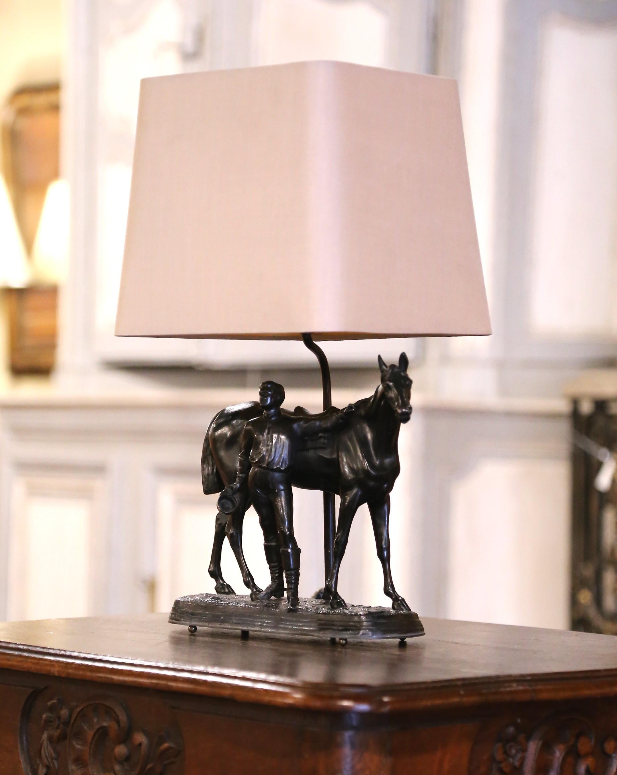 Decorate a man's desk, or lady's writing table with this wonderful antique  lamp composition. Crafted in France circa 1880 in the style of French sculptor F.. J. Mene, the subject built of spelter metal, depicts a jockey standing beside his horse,
