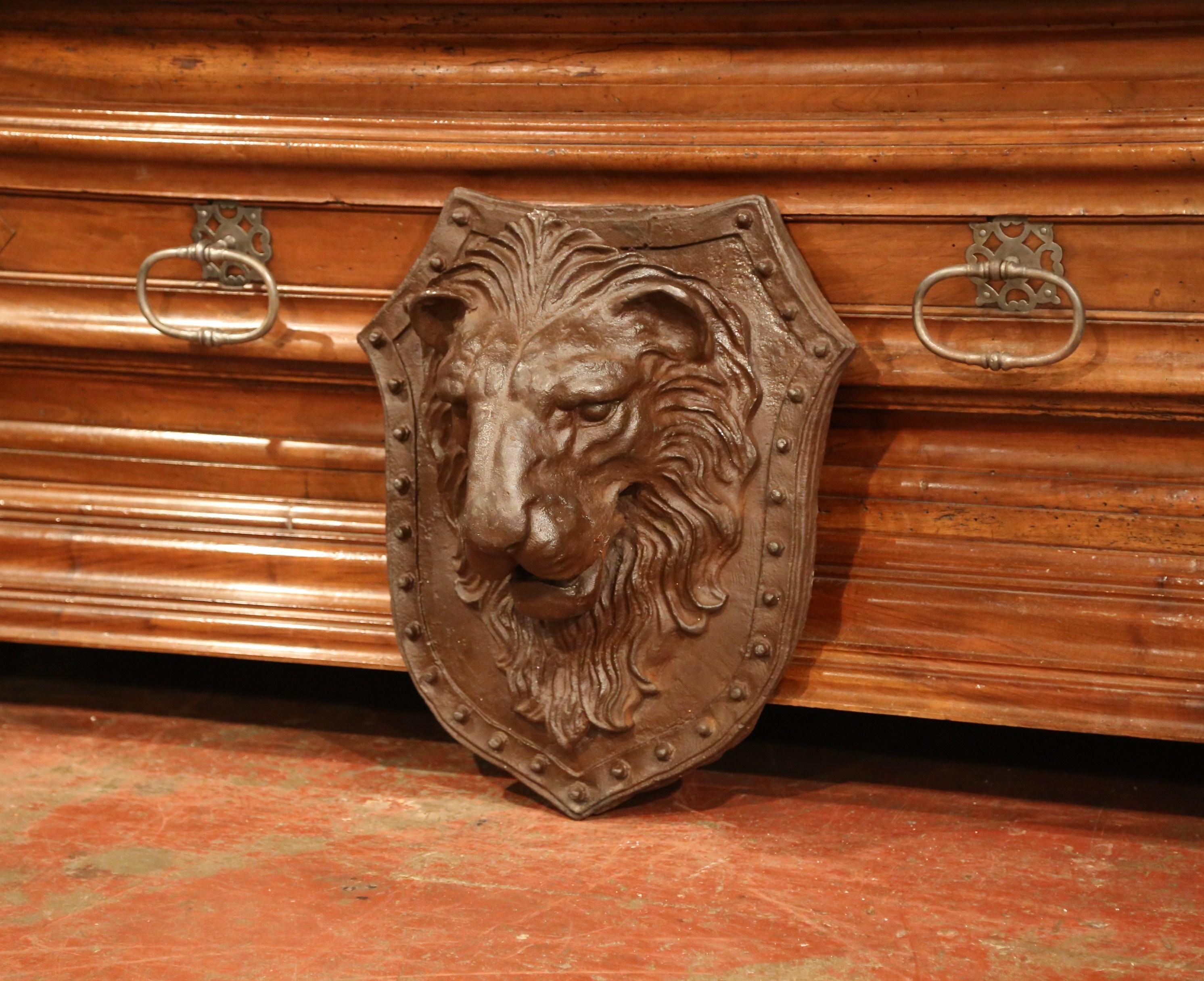 Add strength and power to your house with this wrought iron wall crest; found in Southern France, and crafted, circa 1850, the piece features a high relief forged lion head in the center with decorative bead motif around the perimeter. The mounted