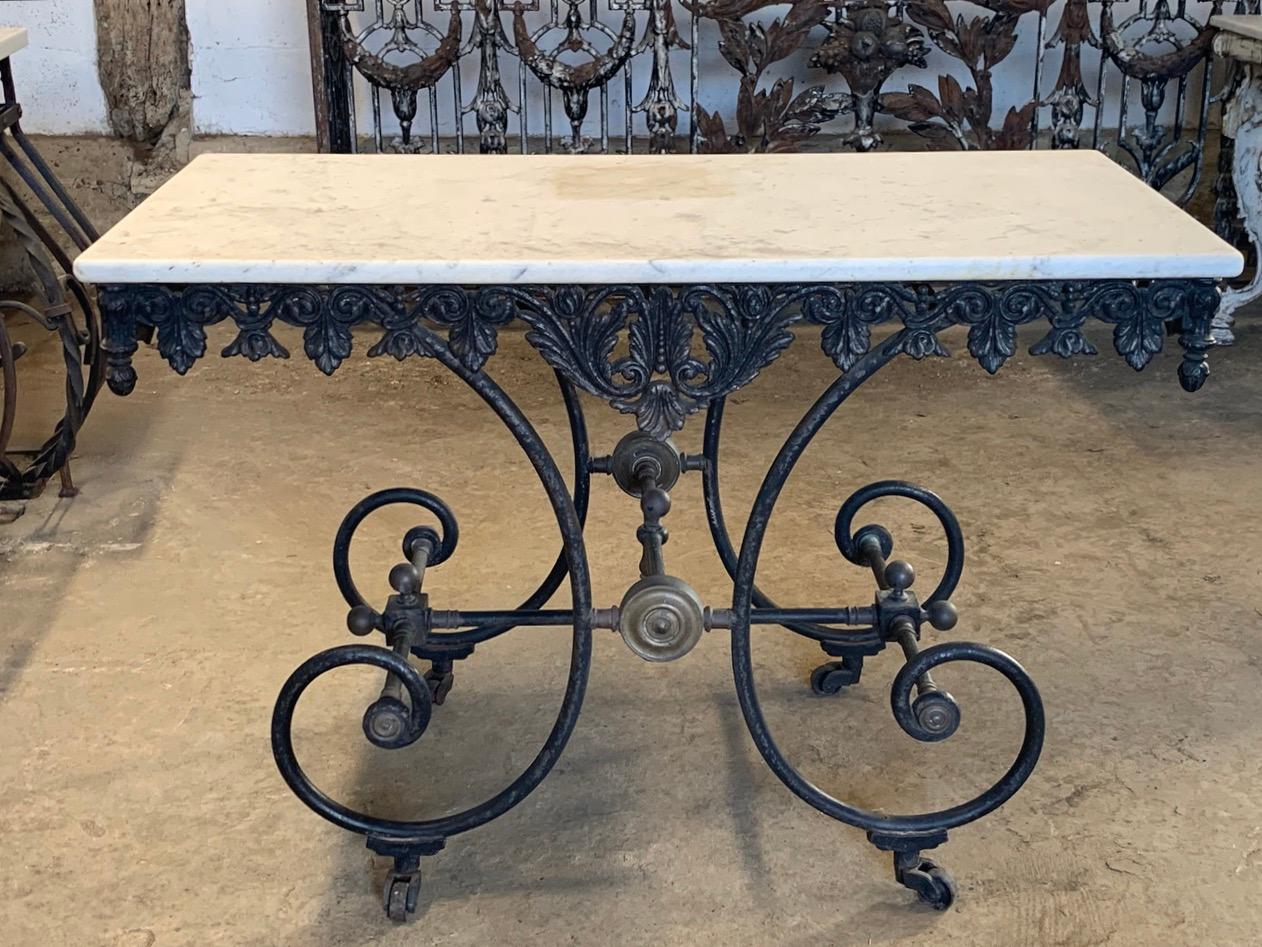 A beautiful 19th century French Patisserie table made from wrought iron with a decorative cast iron frieze. Nice original marble top and casters. This will make a wonderful table indoors or could be used as a garden table.