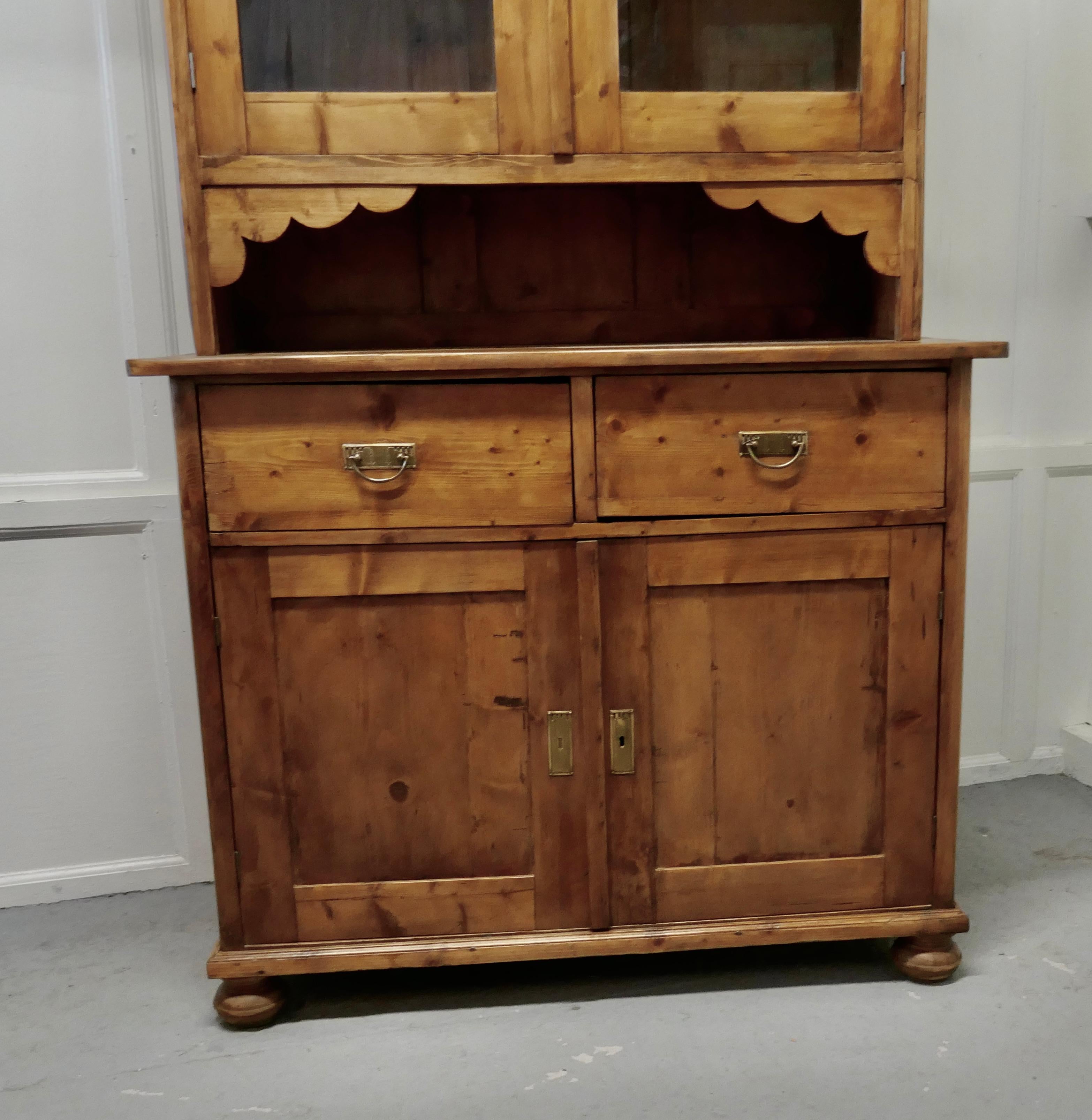 19th century french pine farmhouse kitchen glazed dresser.

This is a good country piece, it dates from the late 19th century
The top section has two Glazed doors enclosing a shelved cupboard, this is set off with a deep cornice.
 
The base of