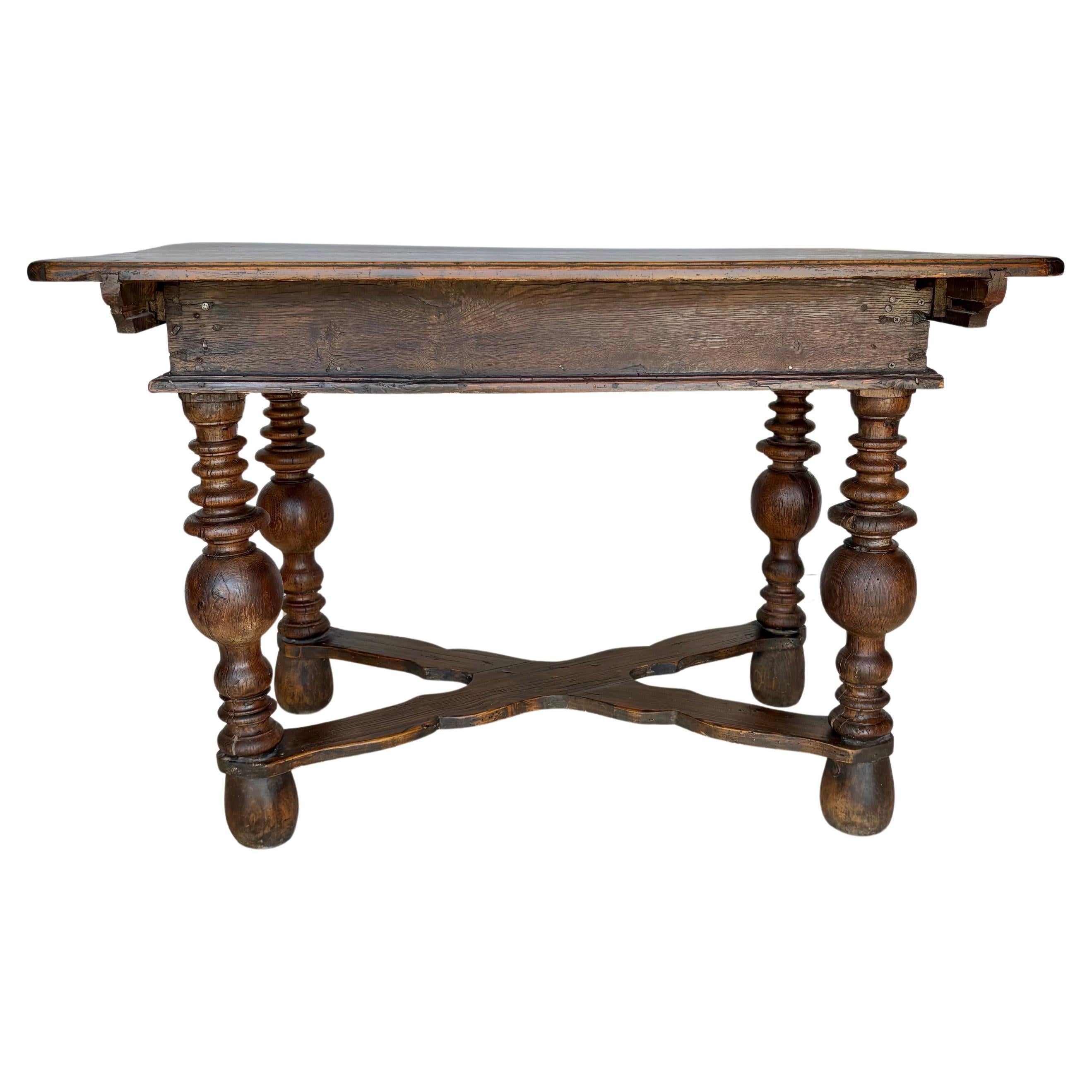 Found in the South of France, this 19th Century Kitchen Work Table was crafted from pine in the late 1800's. The piece features at two planked top, which slides backwards and forwards to reveal a storage compartment underneath. The table rest on