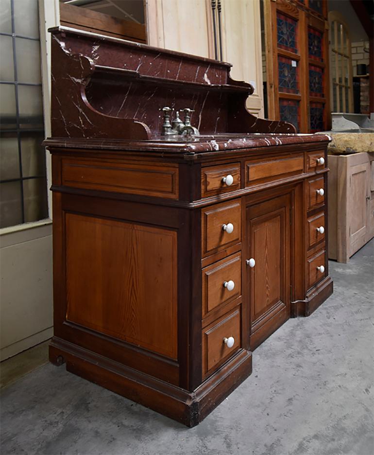 19th century French pitch cupboard sink with pink marble top.