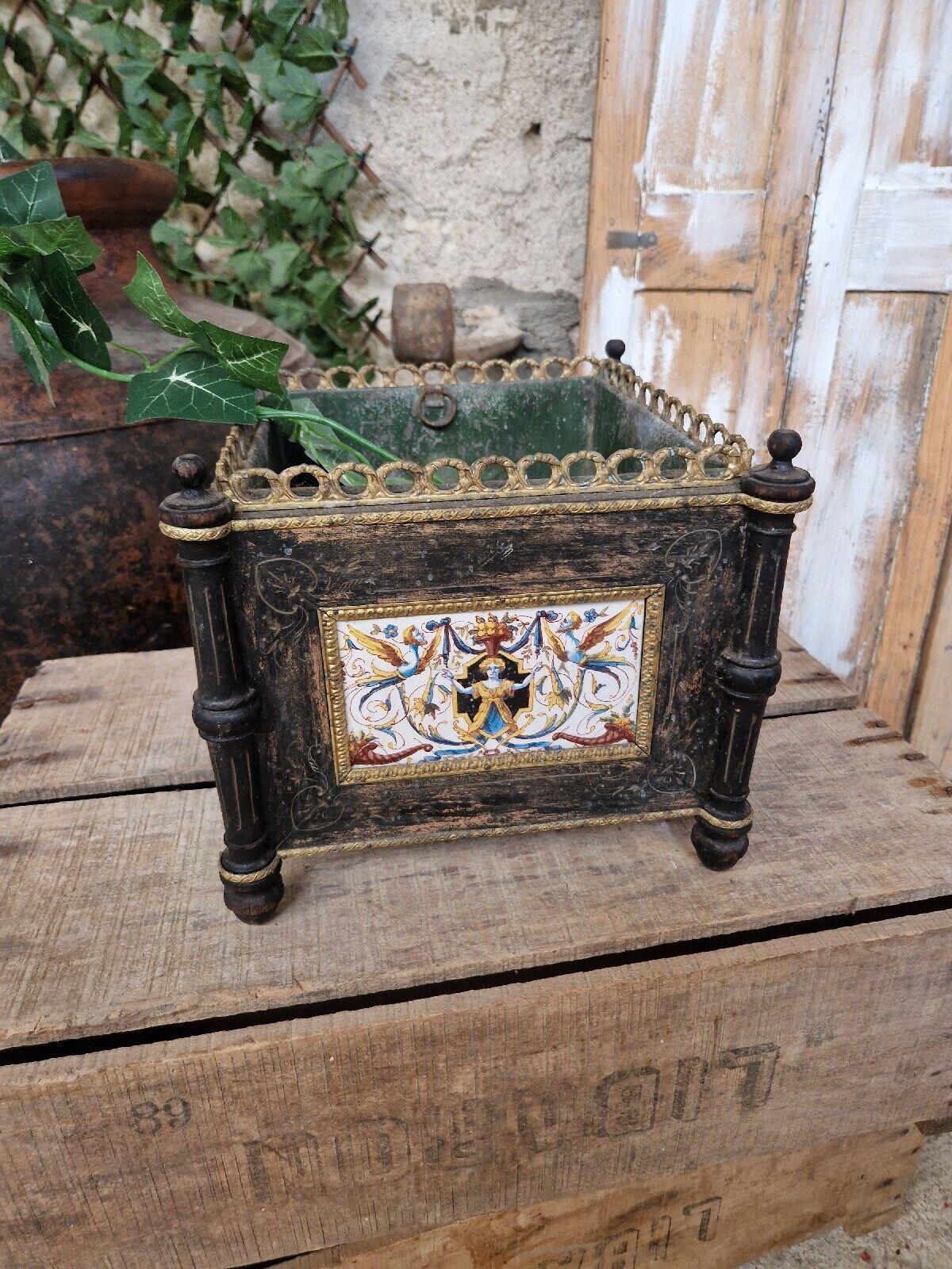 This exquisite 19th-century French planter is a true testament to the timeless beauty of antique craftsmanship. The piece boasts a stunning ebonised black wood finish that is sure to complement any décor. Its sturdy wooden construction guarantees it