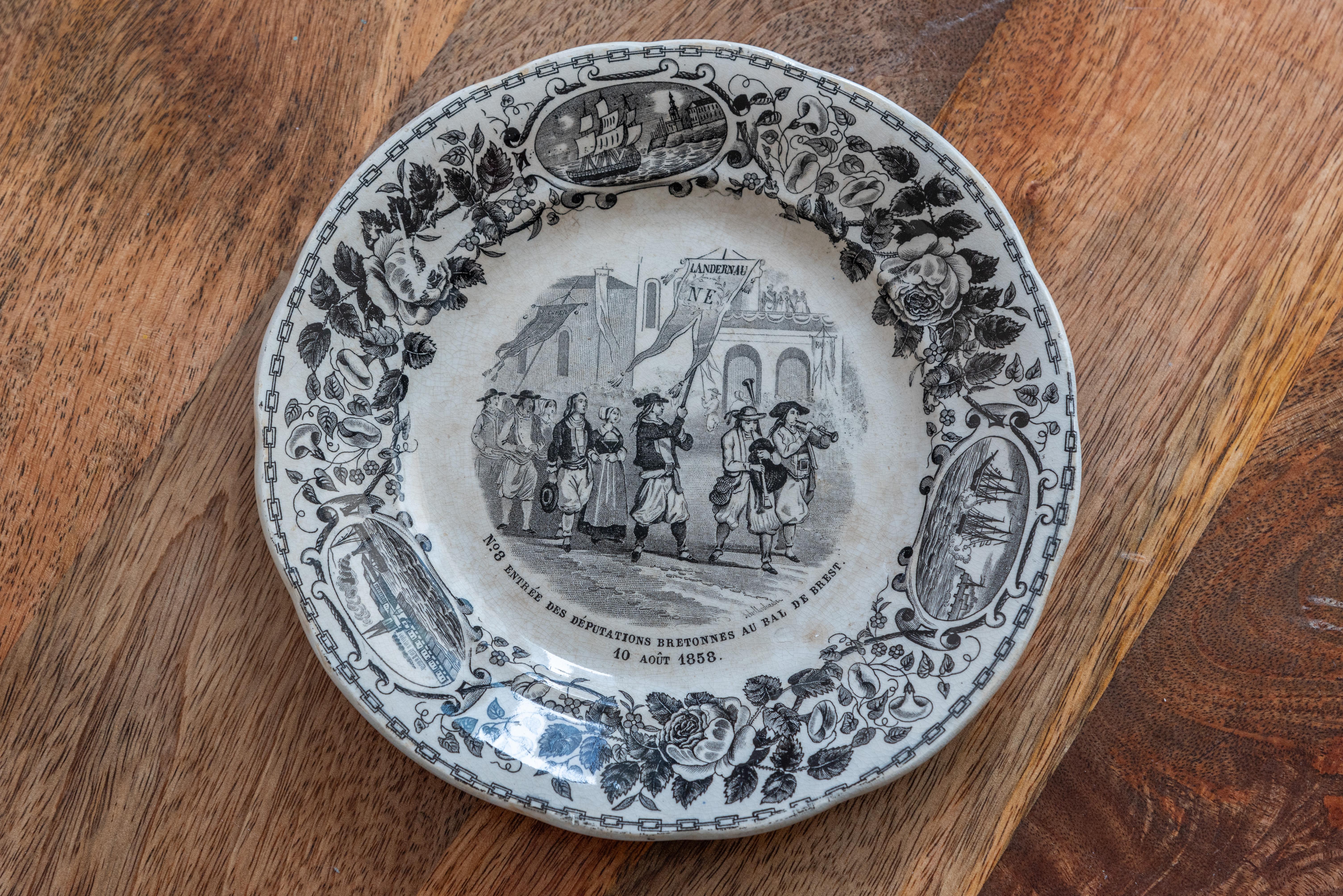 Step into the enchanting world of 19th Century French Plates by Creil et Montereau, a captivating set of eight distinct plates, each adorned with charming depictions of different French military and civil scenes. These remarkable plates are not only