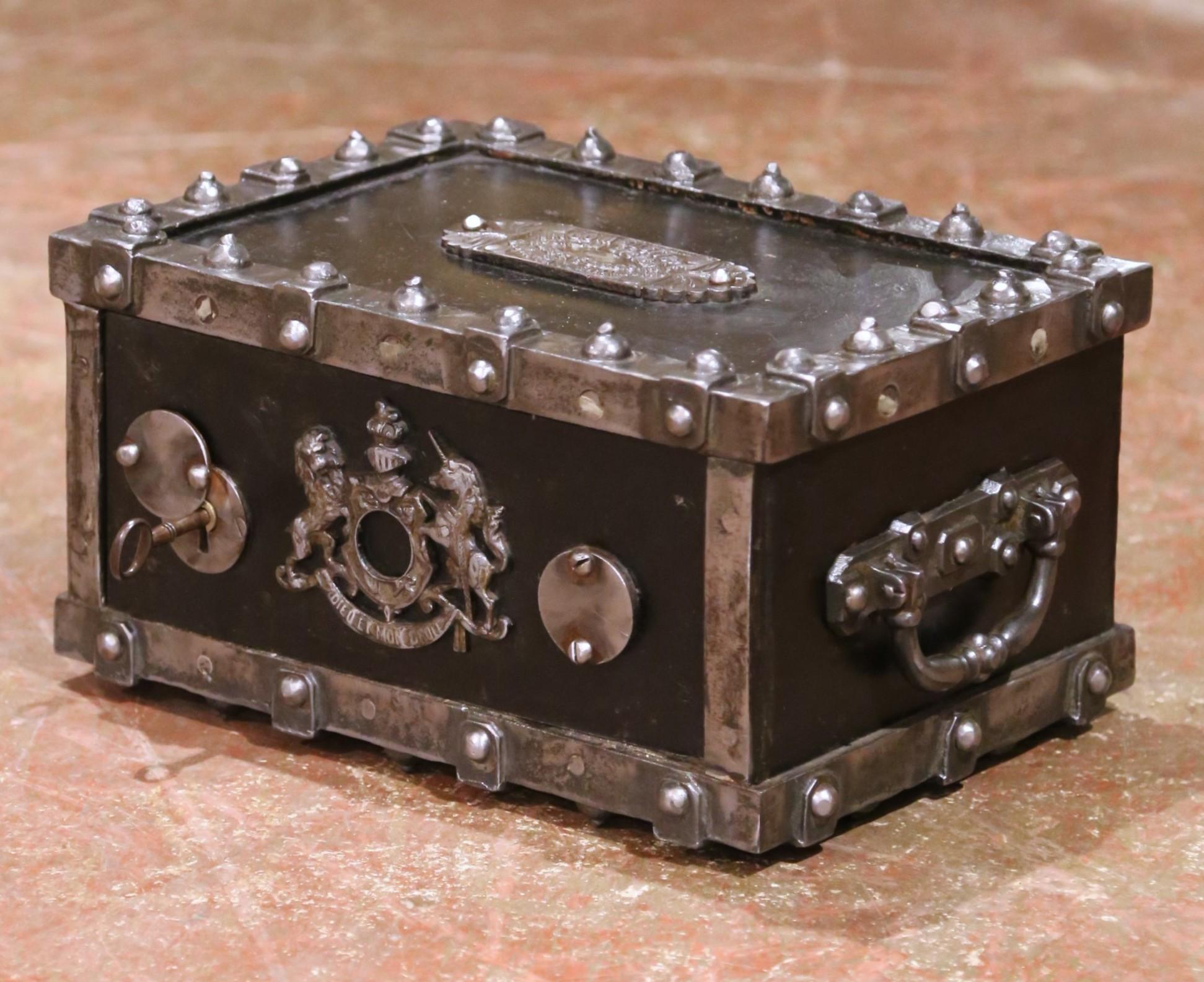 This French fireproof strongbox, crafted circa 1880 by Bauche in the Marne region, showcases the period’s finest industrial security design. Constructed in heavy cast iron and weighing 45 pounds, the coffre-fort features a two-tone finish with