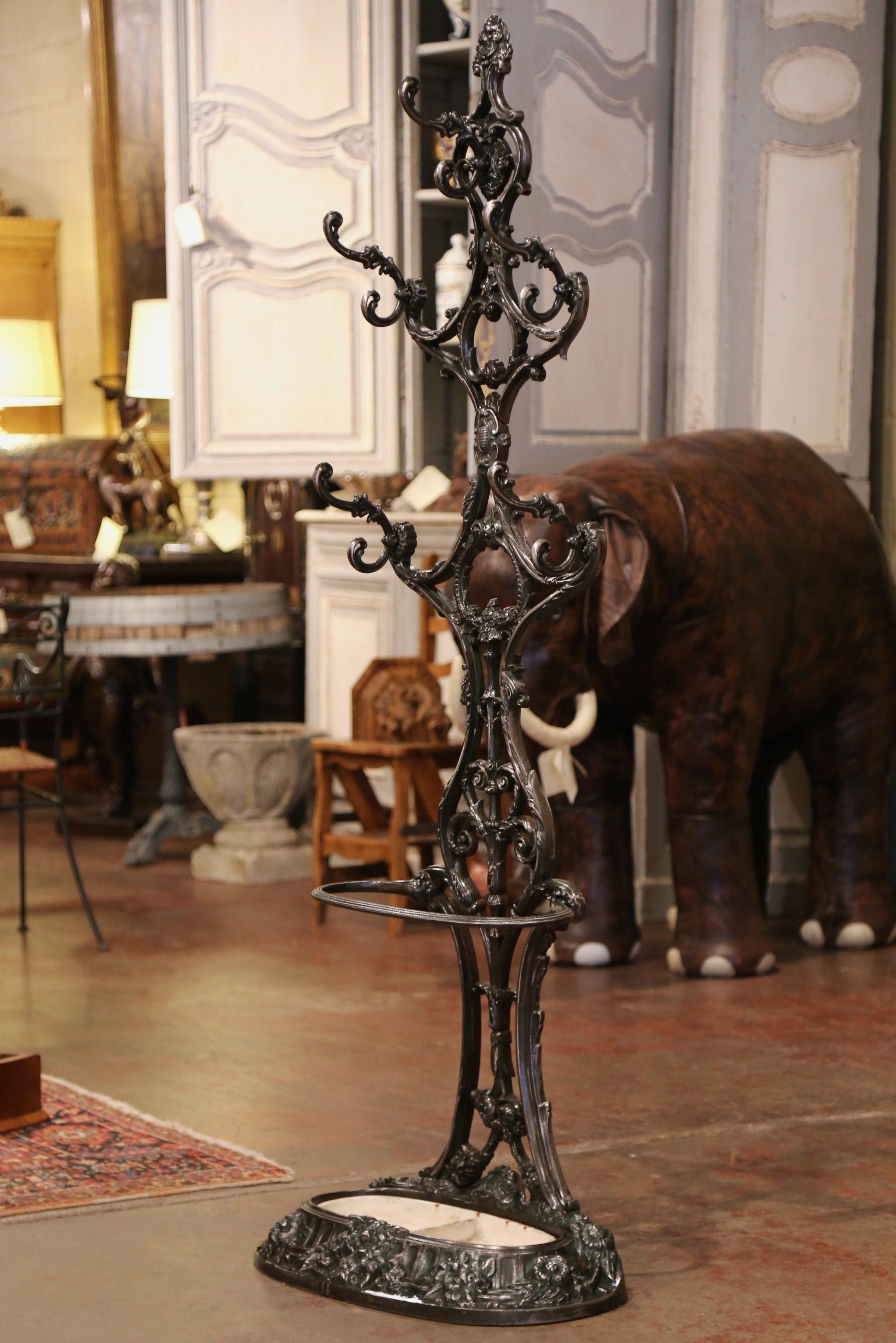 Place this elegant antique hall tree in an entry or a mud room to catch coats, and umbrellas. Crafted in France circa 1870, and signed on the bottom 