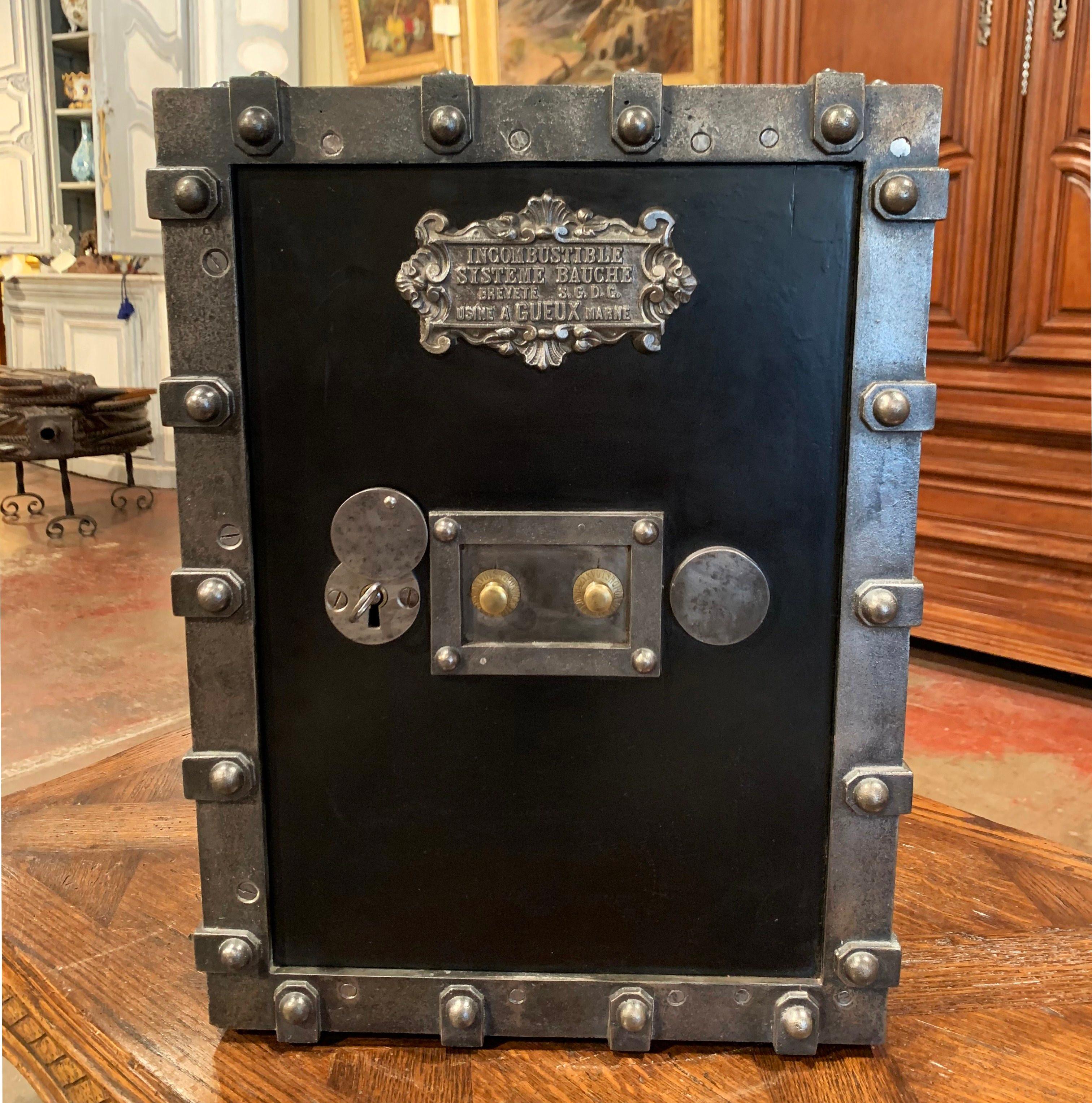 Keep your jewelry and important documents locked up in this elegant, antique safe from the Champagne-Ardenne region of France. Crafted circa 1880 in cast iron with gun barrel finish and finished on all sides, this travel safe is decorated with