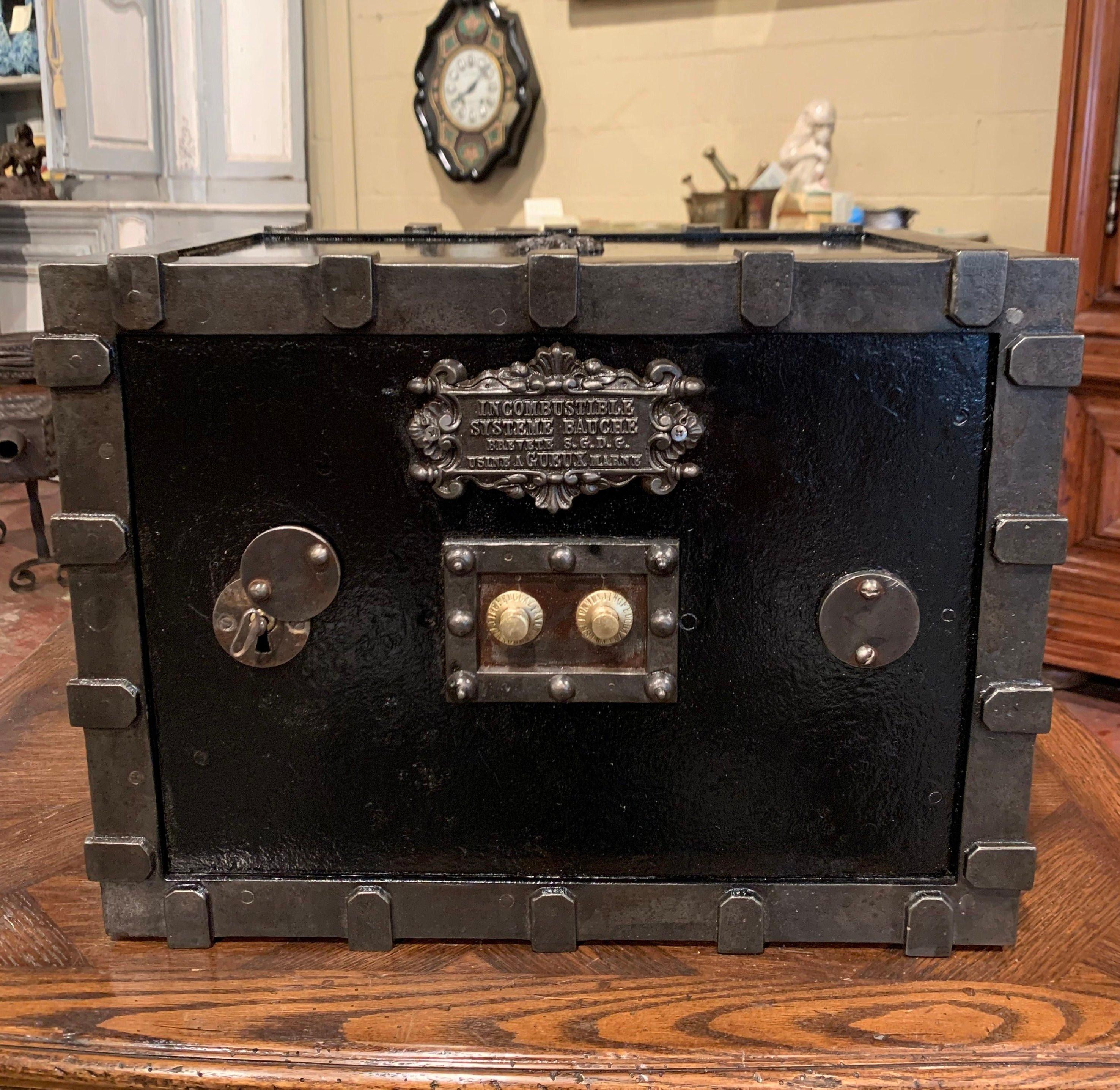 Keep your jewelry and important documents locked up in this elegant, antique safe from the Champagne-Ardenne region of France. Crafted circa 1880 in cast iron with gun barrel finish and finished on all sides, this travel safe is decorated with