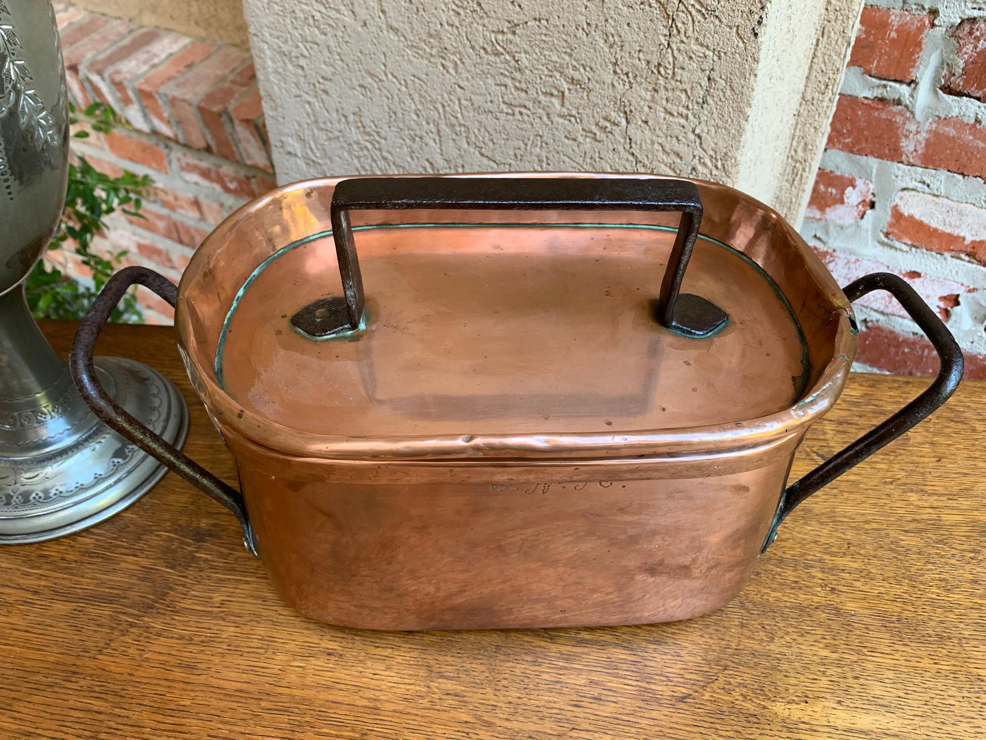 Direct from France, a large oblong antique French copper pot/pan vessel with lid~
~Beautiful copper, polished in France before we exported it~
~Riveted, large iron handles on either side of the pot AND on the lid~
~Hand rolled edges on the