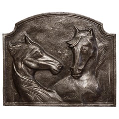 Mid-19th Century French Polished Iron Fireback with Horse Head Sculptures