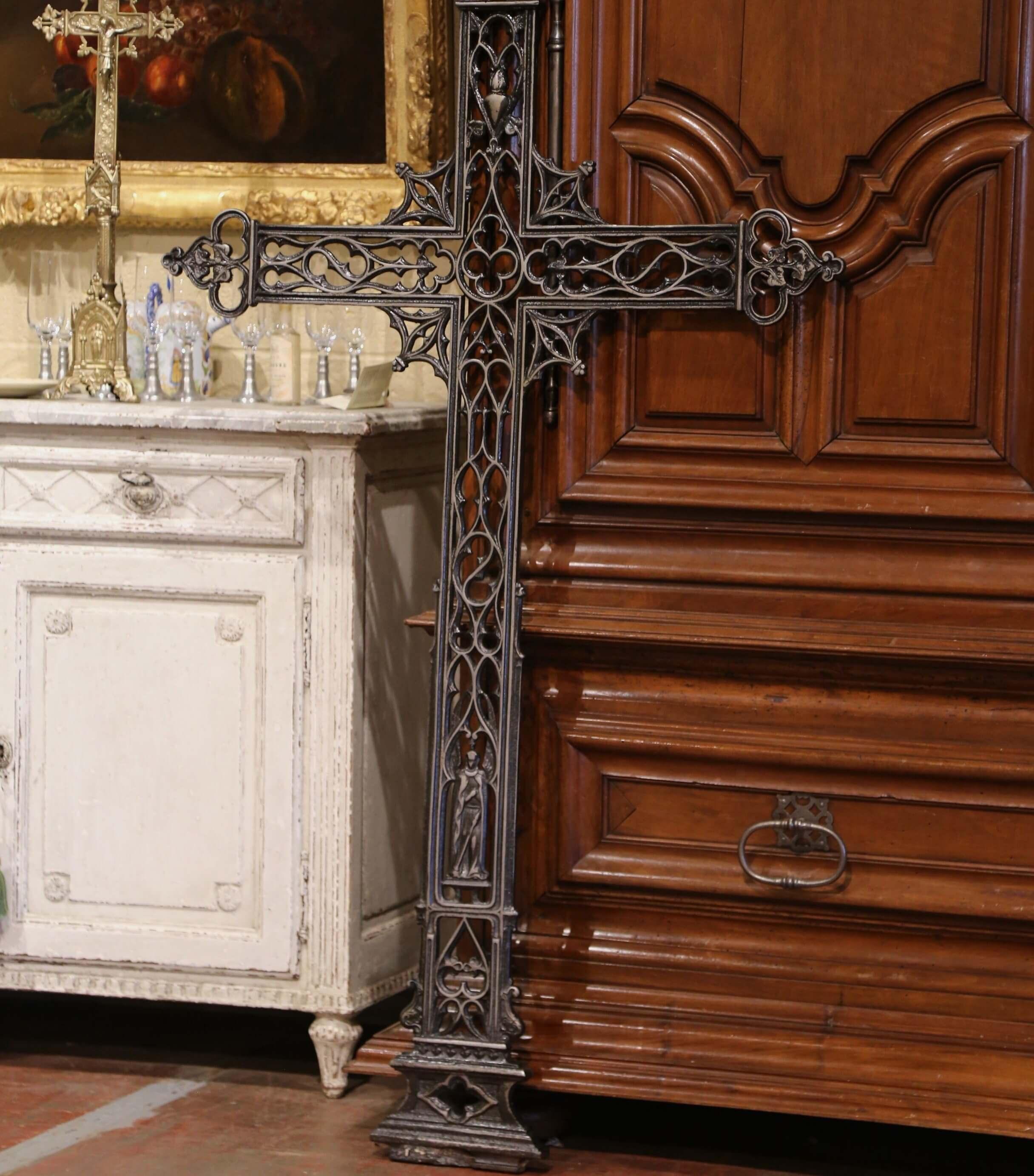 This beautiful antique cross was crafted in France, circa 1870. The large iron religious item decorated with scroll and floral motifs is embellished with the Virgin Mary at the bottom. The tall religious cross is in excellent condition and adorns a