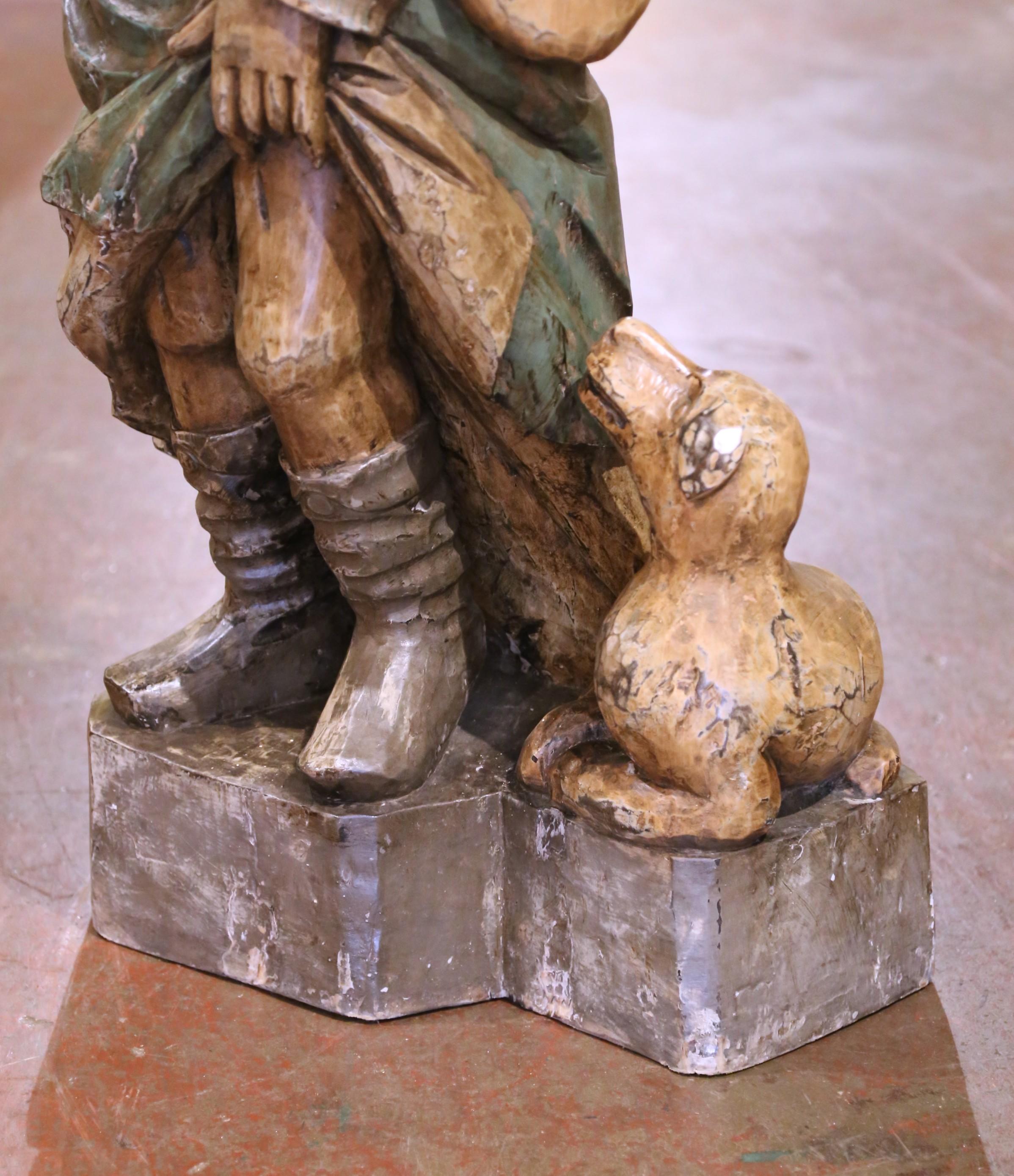 Estatua francesa del siglo XIX de San Roque tallada en madera policromada Tallado a mano en venta