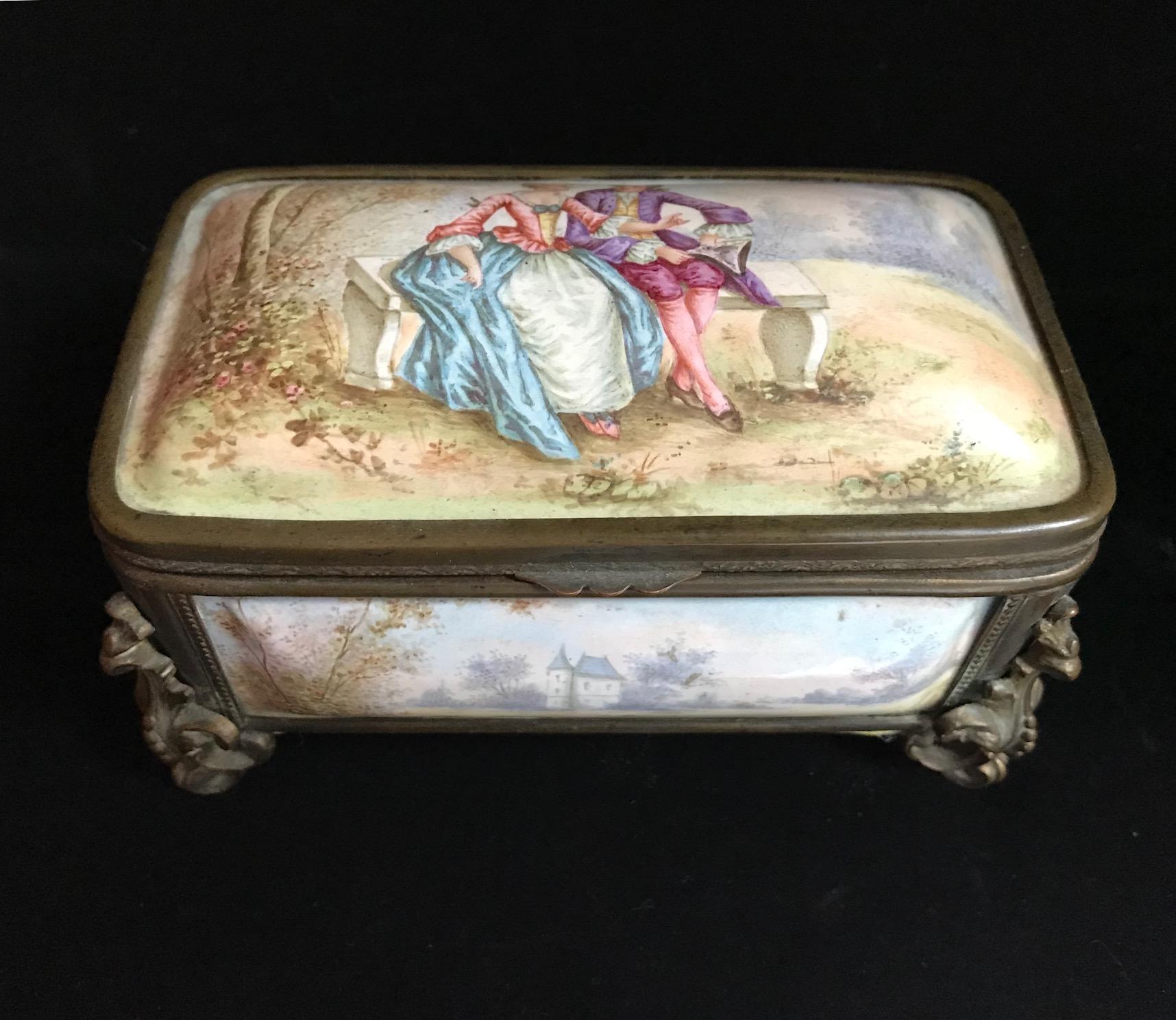 This is an exceptional, fine and impressive antique French enamel polychrome painted casket. Each panel of the box is painted in the 18th century manner with charming landscape motives. The hinged lid is decorated with a lovely, Fragonard inspired,