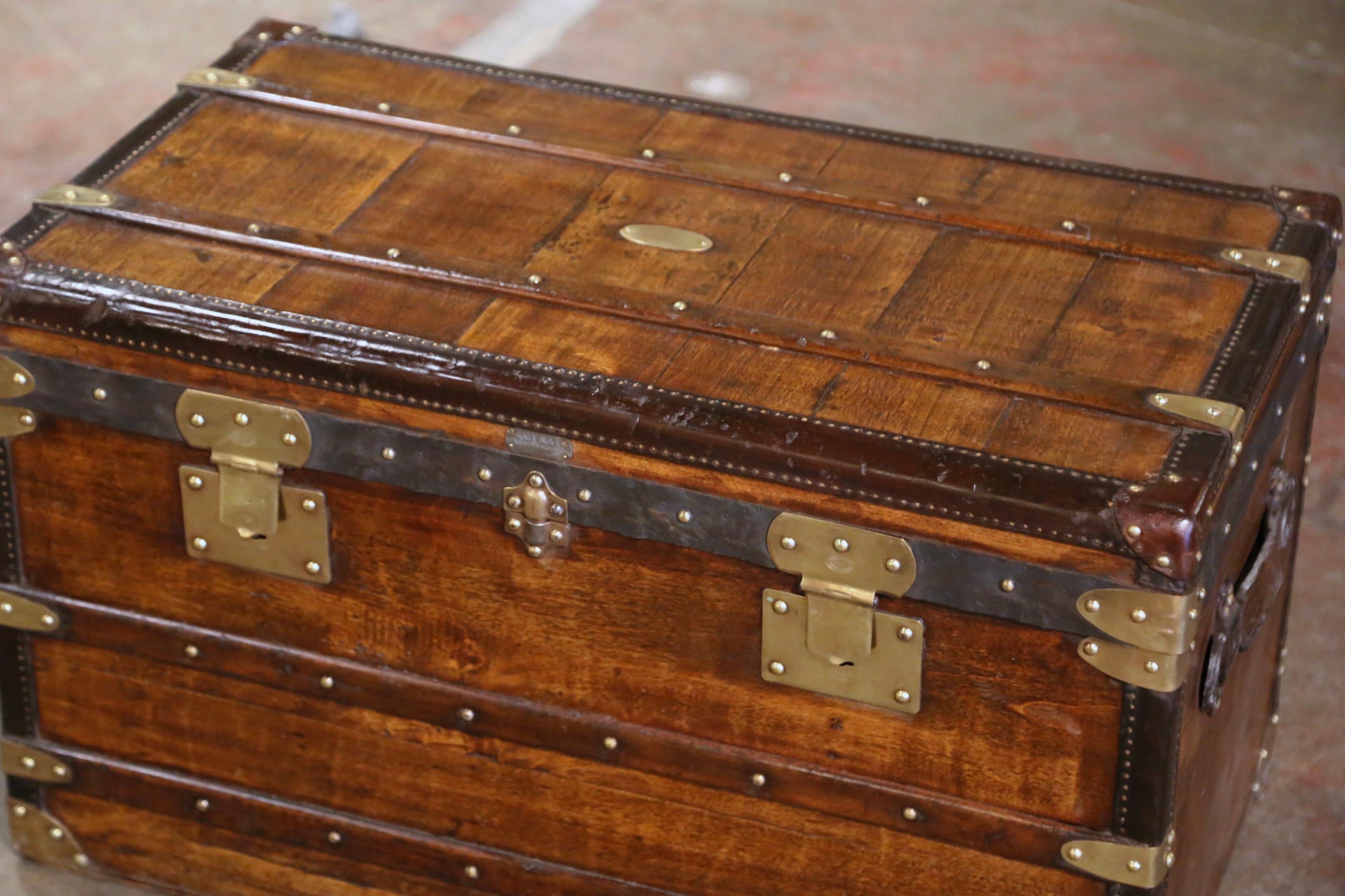 Rectangular in shape and finished on all four sides, this beautiful travel trunk would make an elegant coffee table. Crafted in Paris, France circa 1895 by Maison Moynat in the style of Louis Vuitton, the fruitwood trunk with leather side handles,