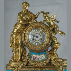 Orologio da camino figurativo francese del XIX secolo in porcellana e bronzo dorato