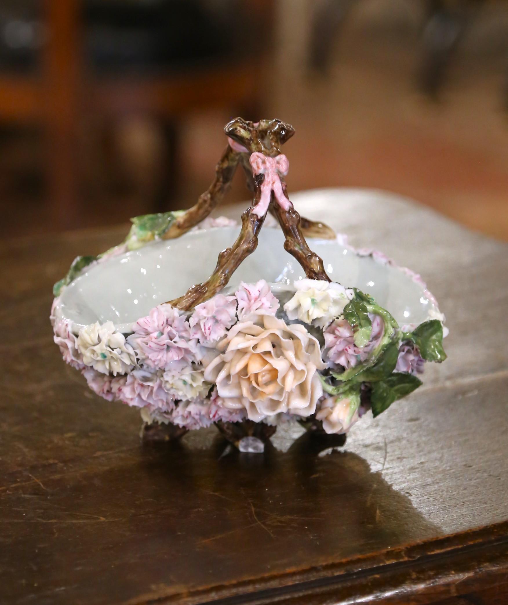 Delicately crafted in France circa 1880, this charming barbotine porcelain basket captures the naturalistic beauty of late 19th-century floral ceramics. The oval vessel is richly adorned with an explosion of hand-modeled flowers in full relief,