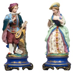 Figurines en porcelaine française du 19e siècle Joueur de guitare et Singer