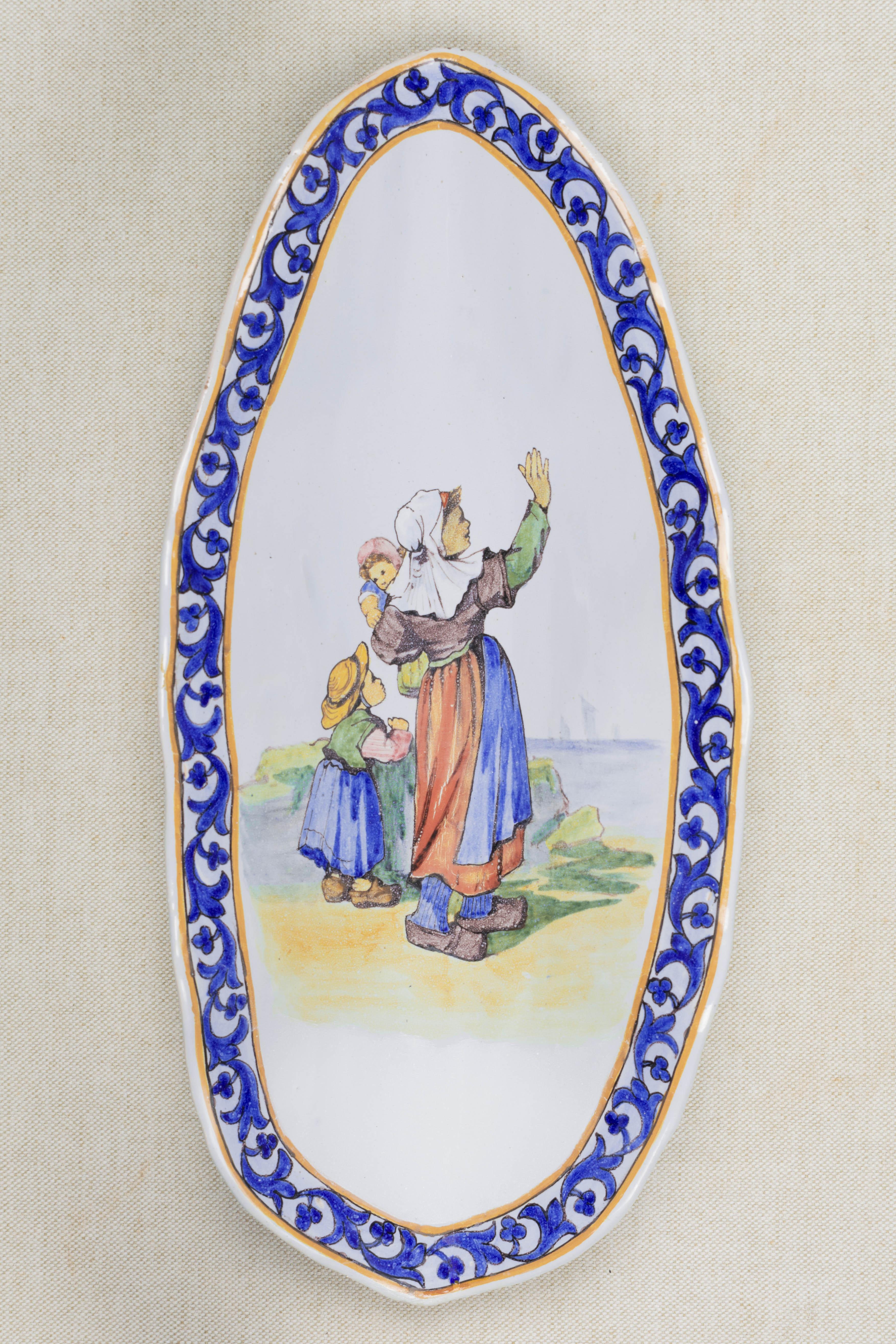 A 19th century French Porquier Beau Quimper faience oval dish with ruffled edge. Unusual form. Titled 